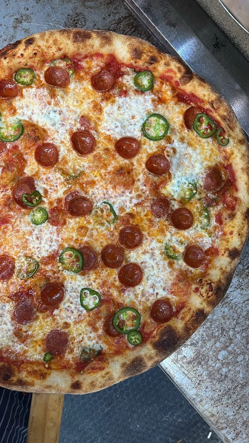 Super Dough pizza with pepperoni and sliced jalapeños.