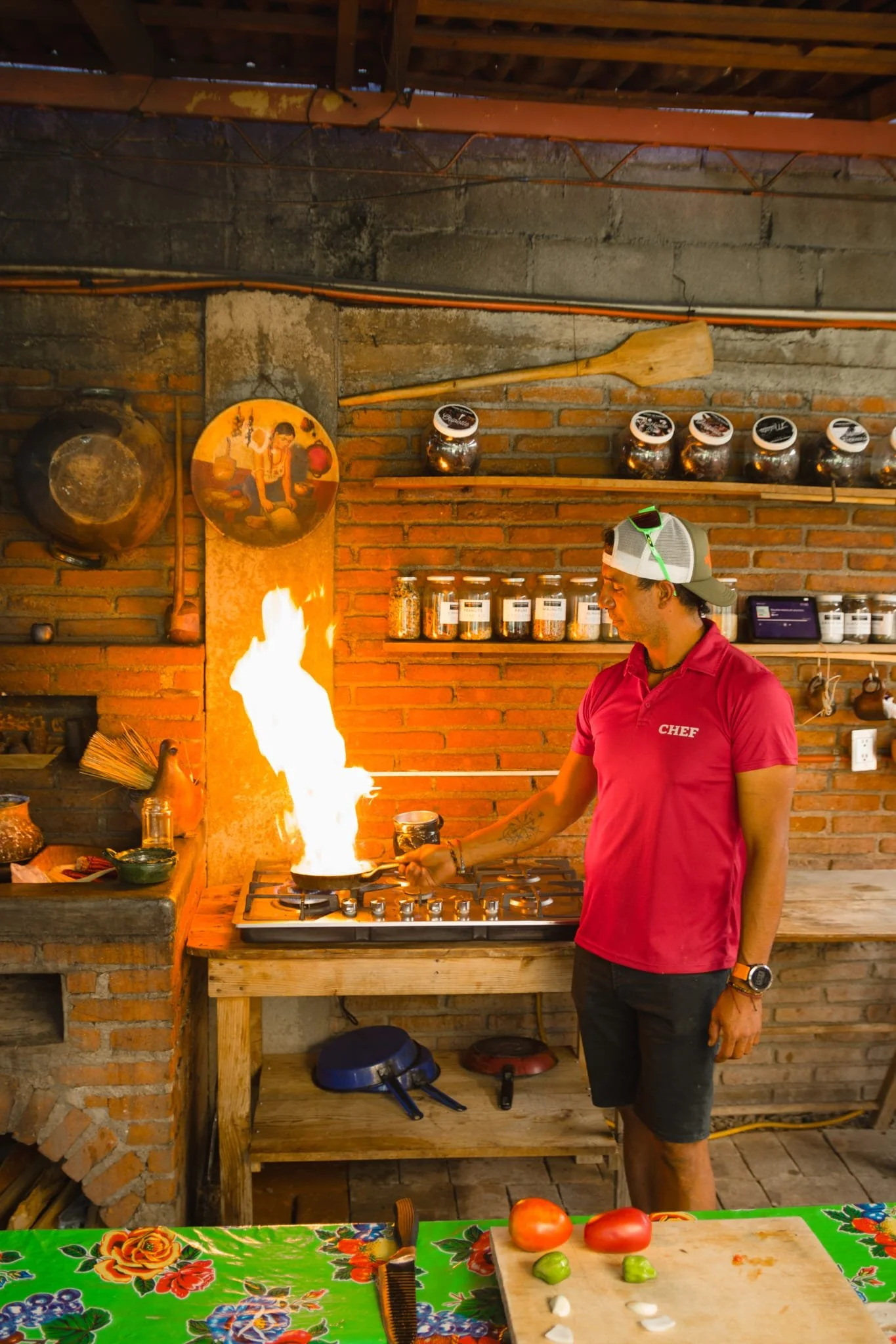 chef Miguel cooking with strong fire at Quinta Brava
