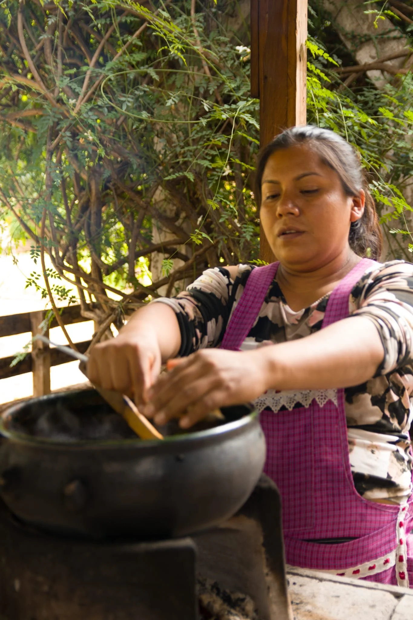 traditional black mole cooking over wood fired stove