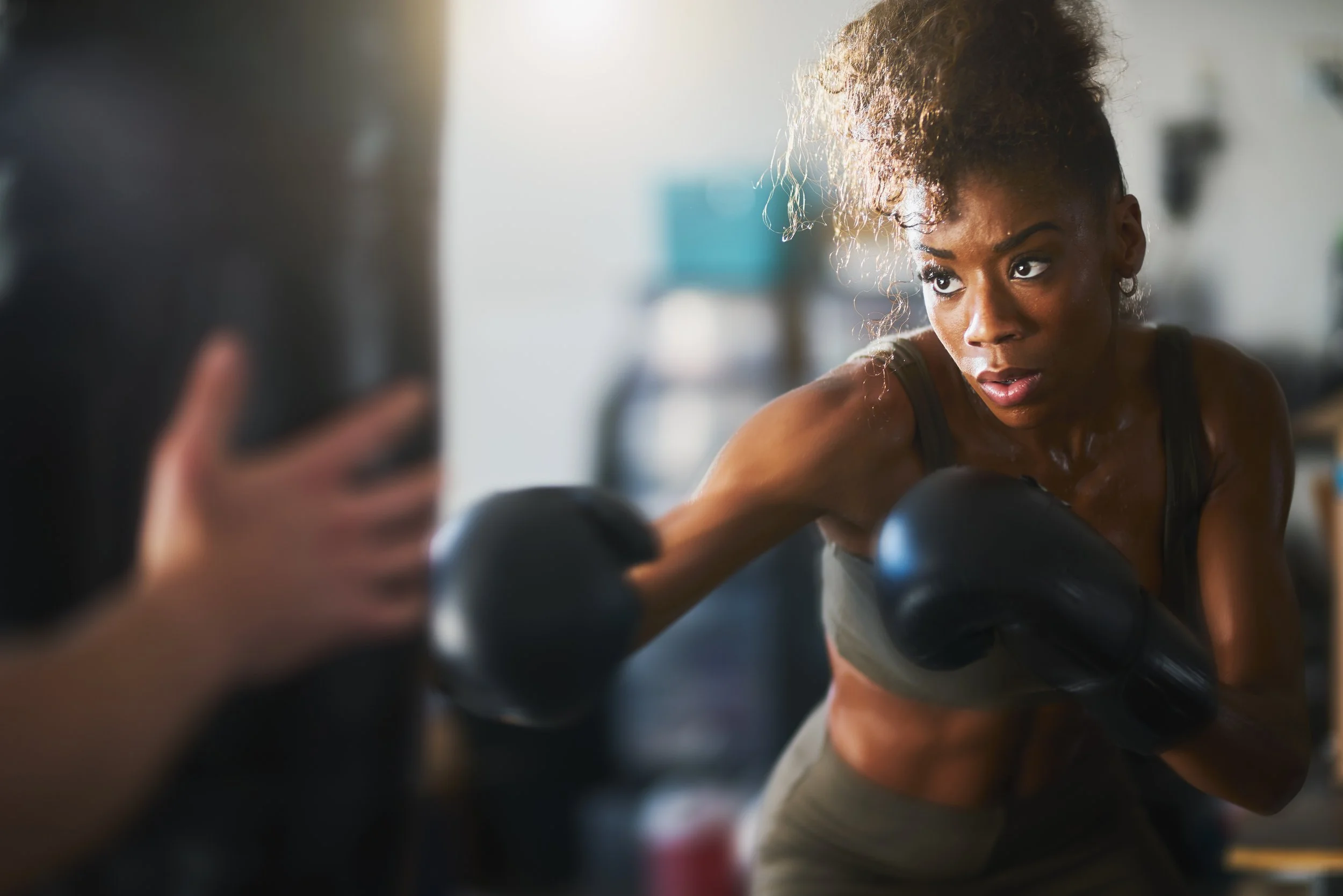 Woman boxing a punching bag
