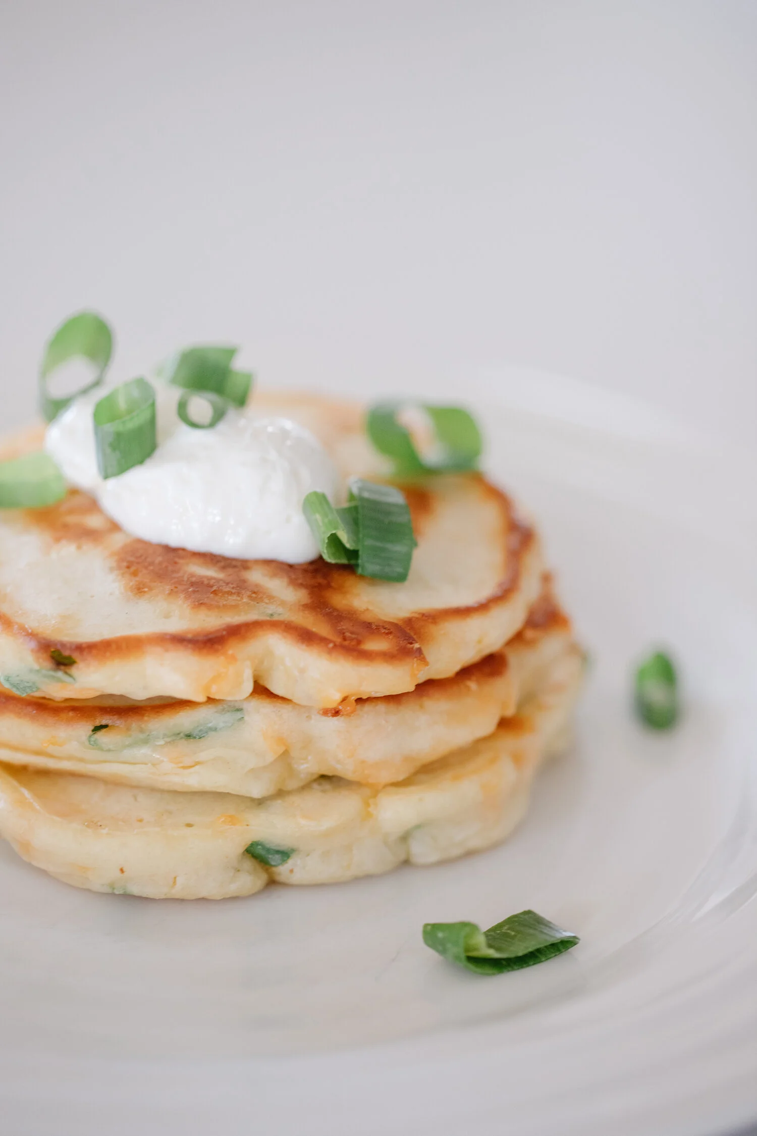 Close up of the savoury pancakes on a plate.