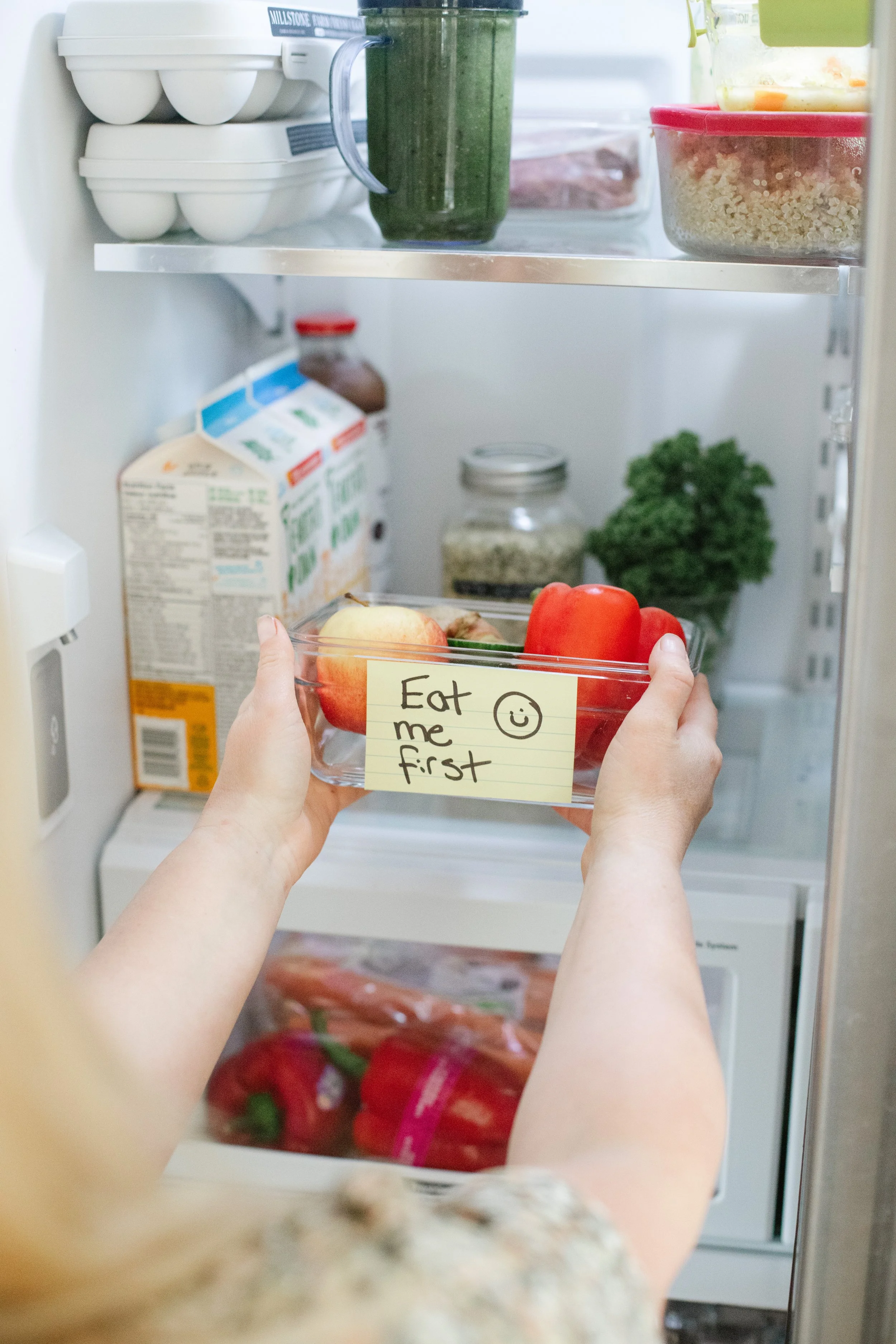 "Eat me first" bin in Tasha's fridge to prevent food waste