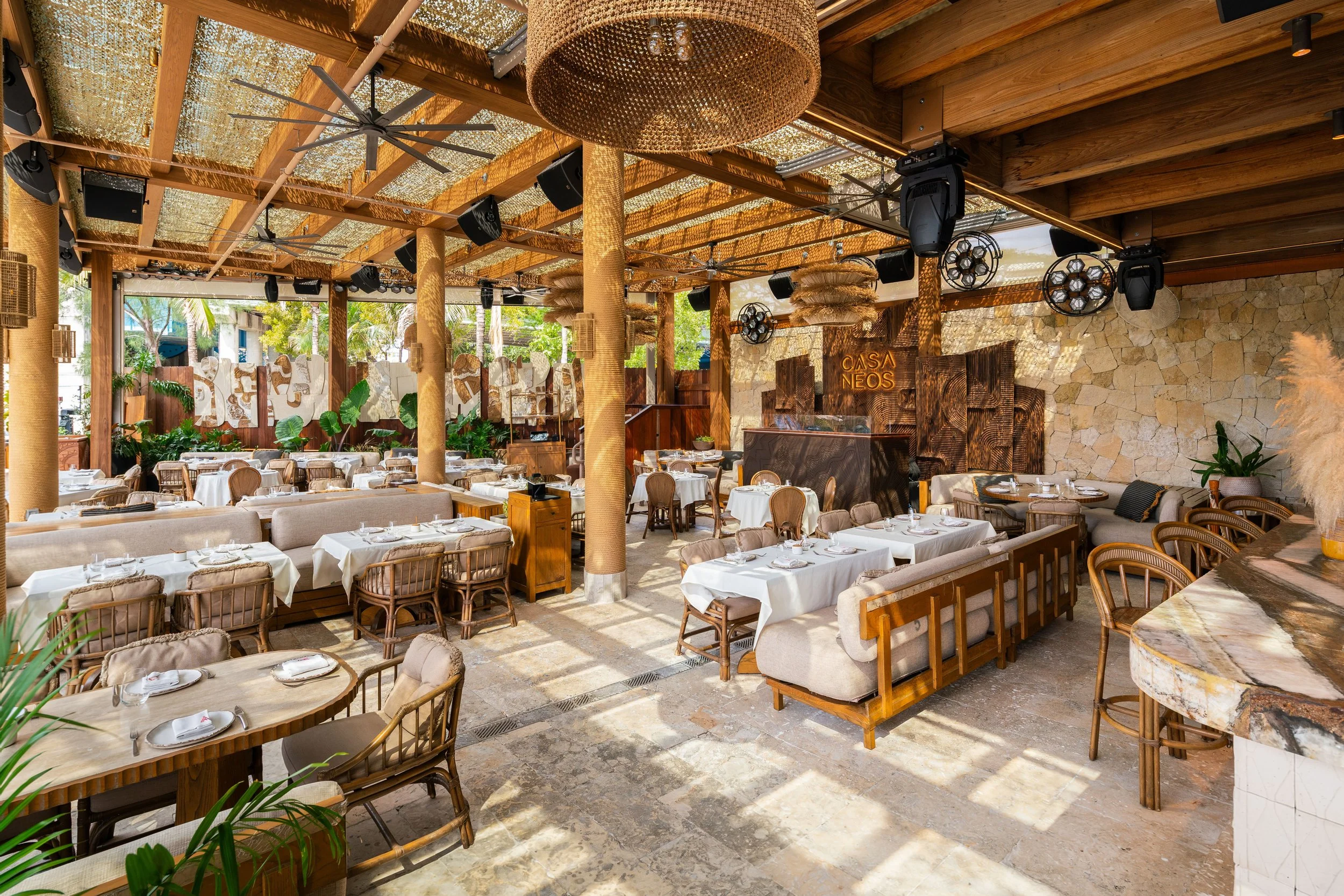 Open-air luxury restaurant setting at Casa Neos on the Miami River.