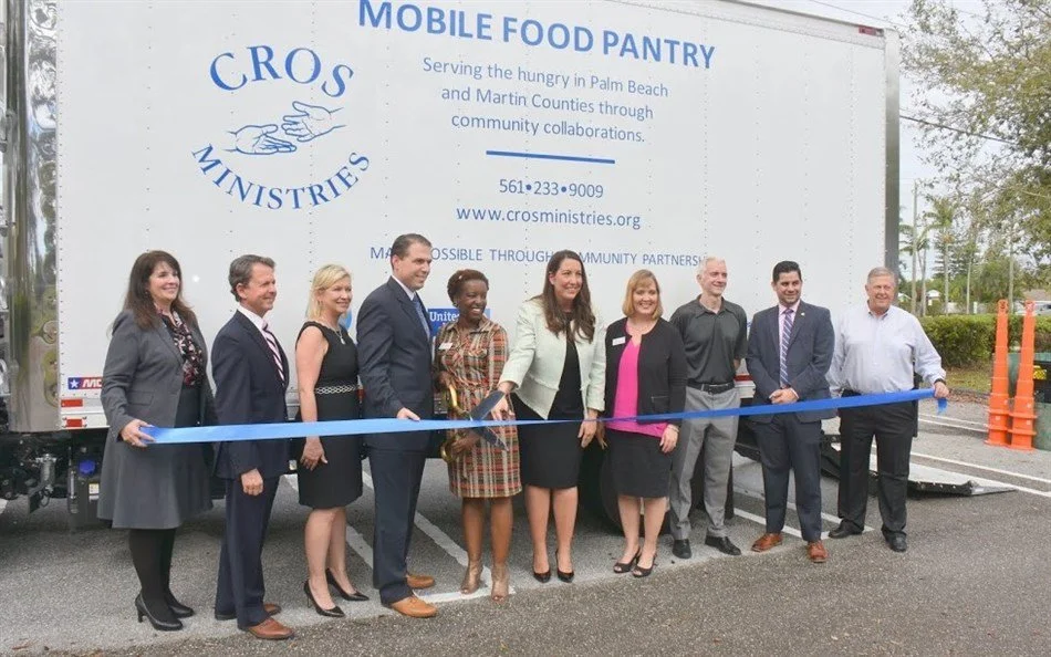 Text in white font on a light blue background that says 'SERVE the city'.