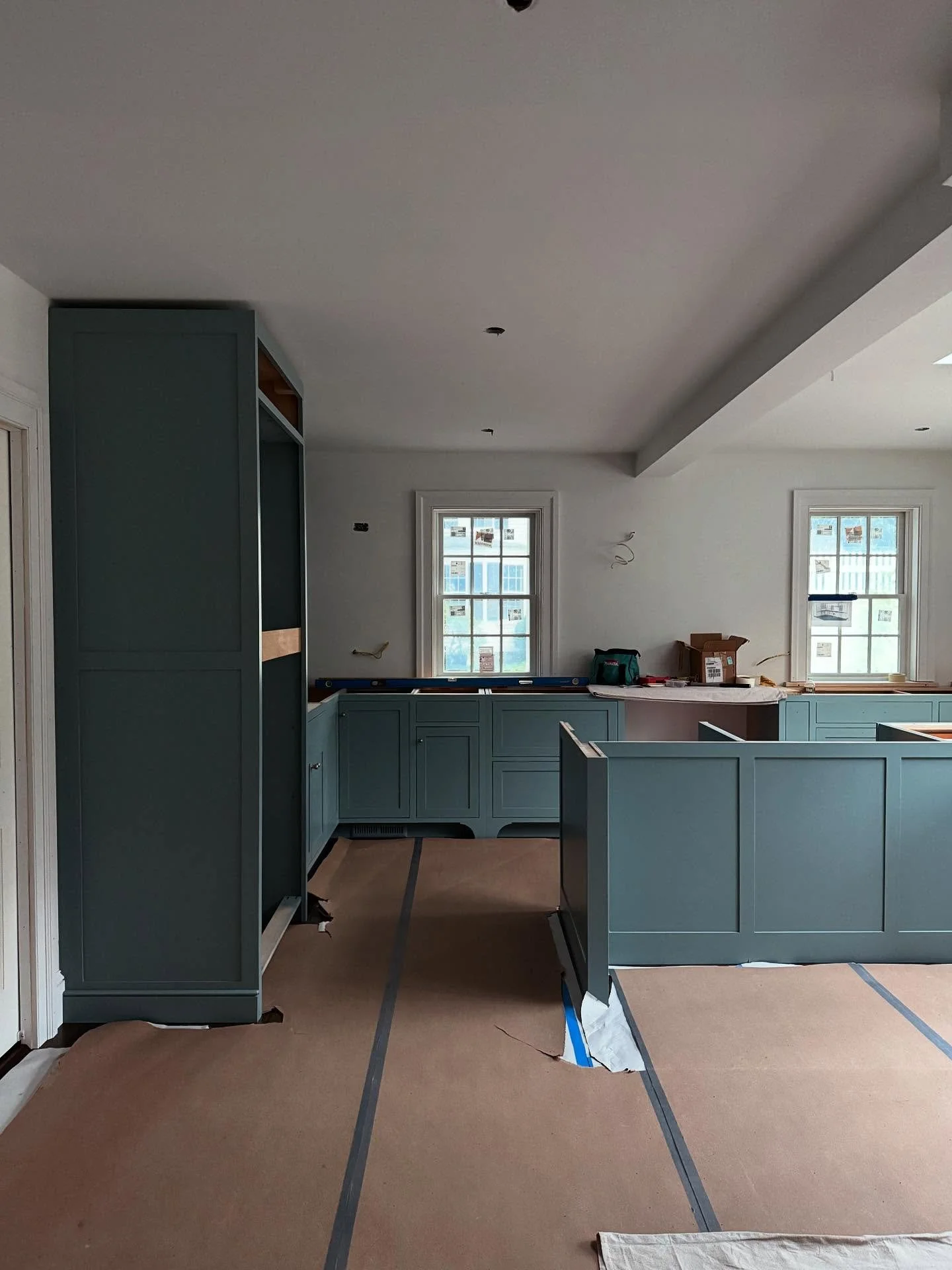 Nothing like a good cabinet installation to make a blank canvas feel like a kitchen. But not too kitchen-y I hope&mdash; the vision is for a comfortable space to congregate and create meals and memories. The blue is calming and changes throughout the
