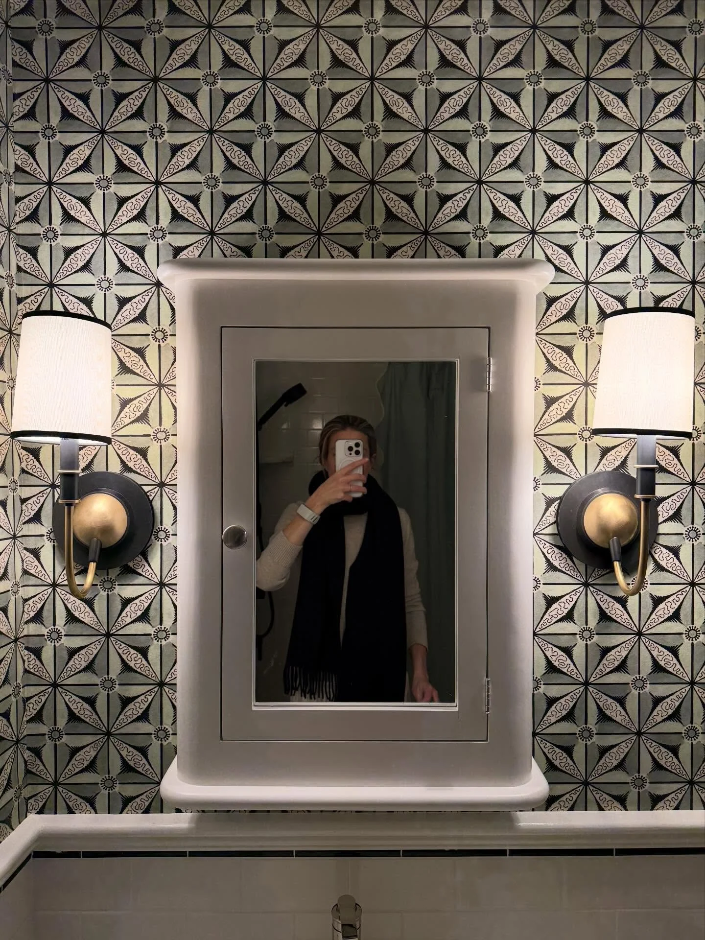 Took my kids bathroom from sad clinical to tr&egrave;s chic with a modest upgrade of fixtures and fun wall covering from the inimitable @antoinettepoisson . Playing off the classic white subway with black accent in the tiles (also on the floor), jugg