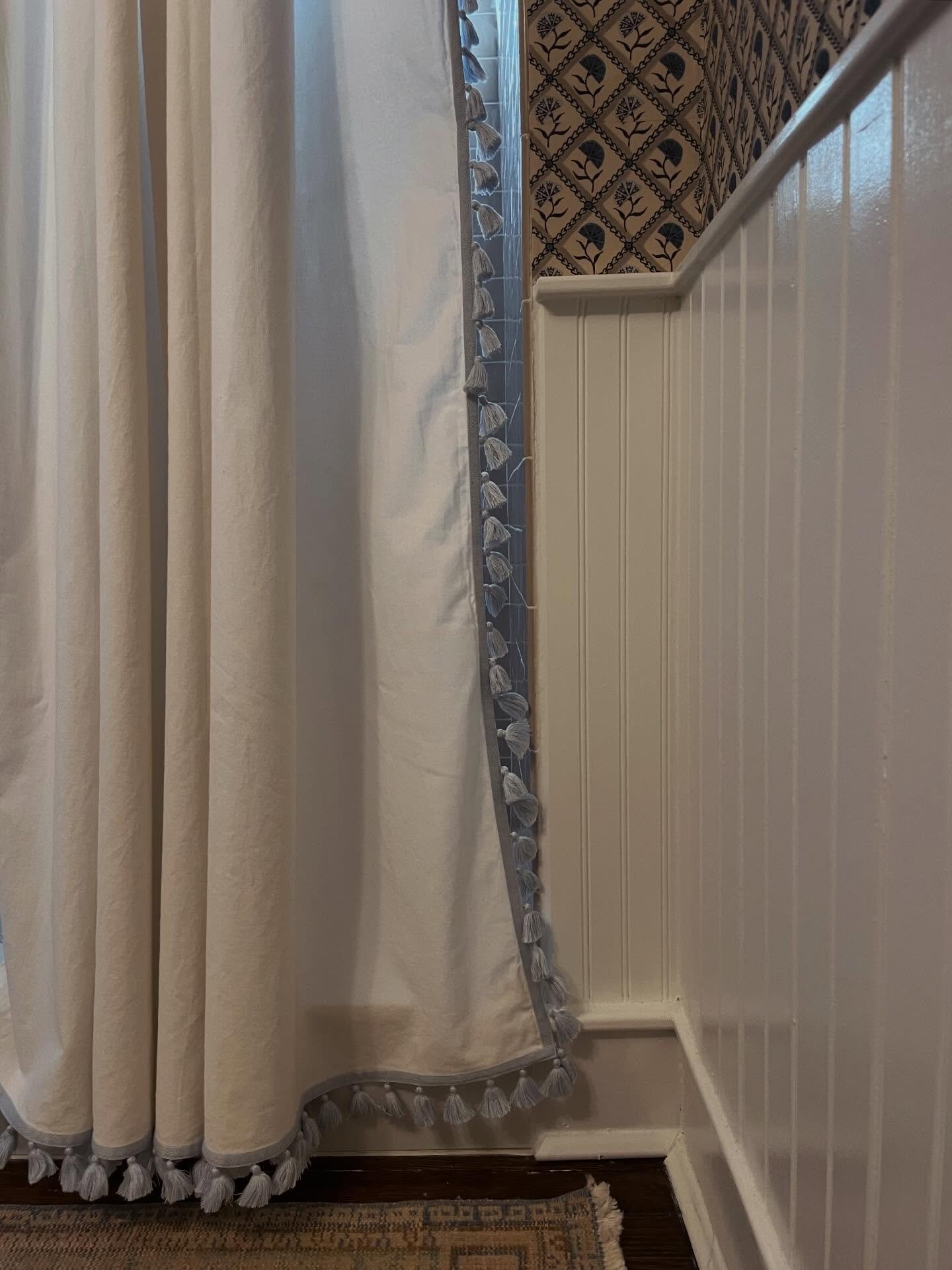 I live for the little details within the big picture&hellip; the tassels on the shower curtain add texture and emulate the floral shape on the wallcovering. 

PSA hot take: bathrooms are rooms! I kept the existing hardwood and found the perfect vinta
