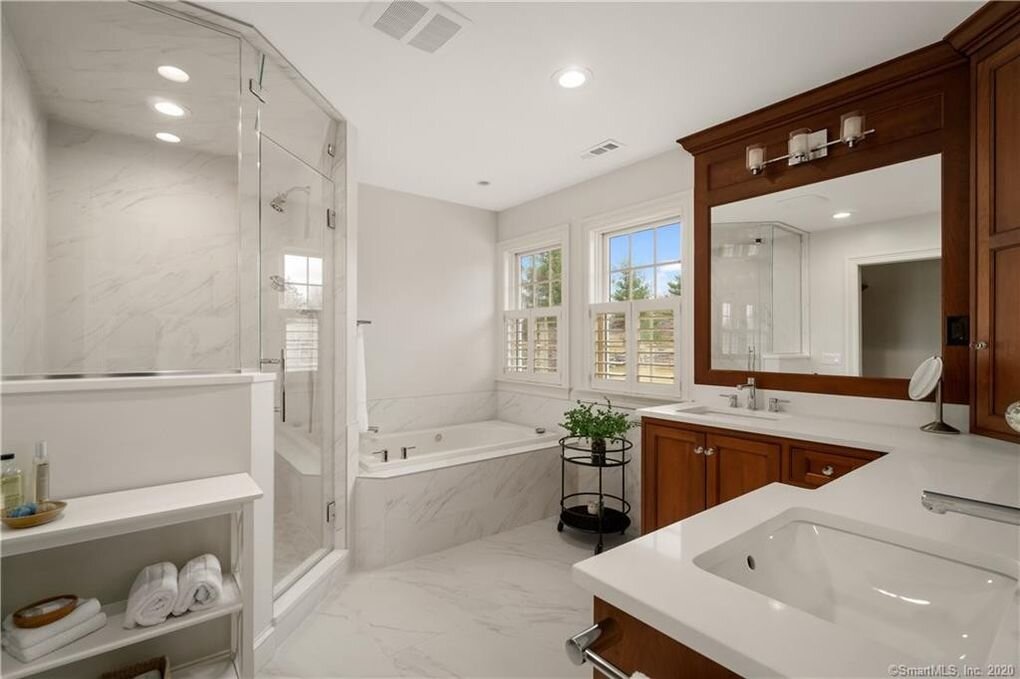 Titus Built - Expansive Modern Stone Bathroom