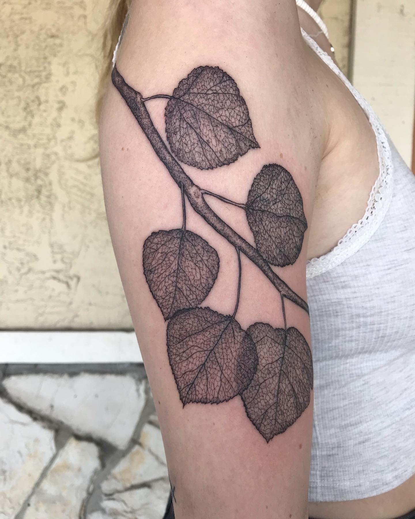 Nature-inspired Stick and Poke Tattoo with Intricate Leaf Design