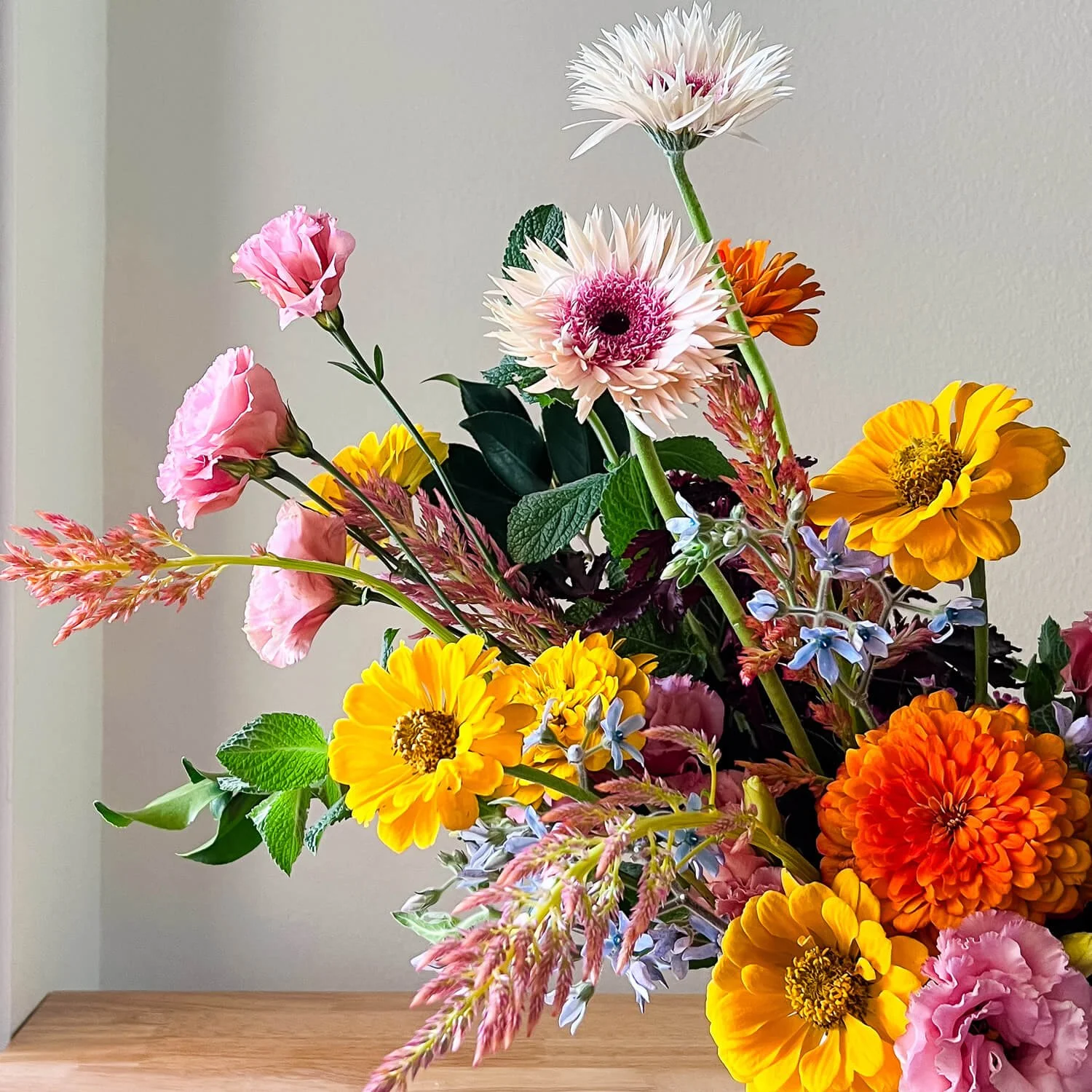Curated desert botanical arrangement for birthday or anniversary delivery in Palm Springs, professionally styled in a ceramic vase.
