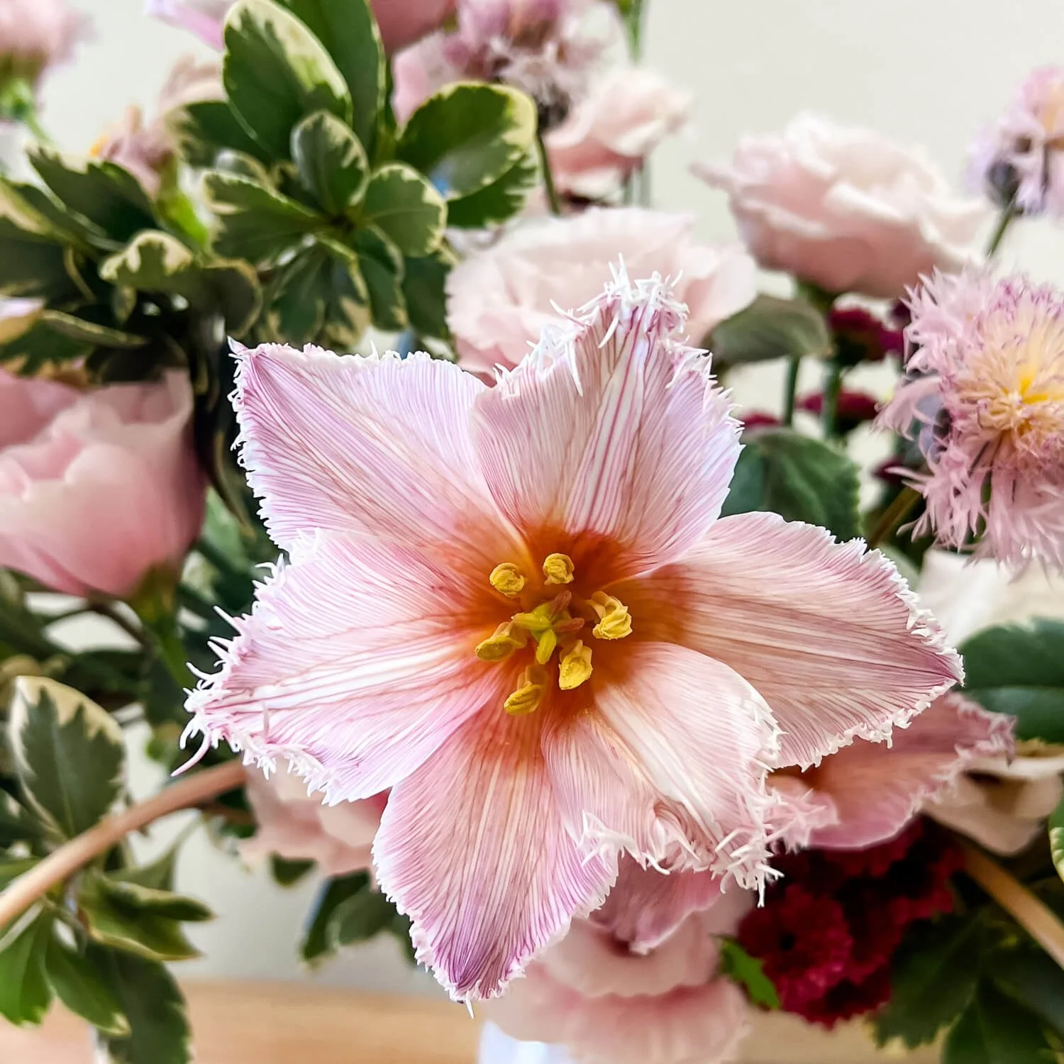 Fresh flower delivery in the Coachella Valley; a bespoke desert-inspired arrangement in a vessel by local florist Posy Laboratory.