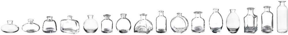 A row of various empty glass bottles and jars against a black background.