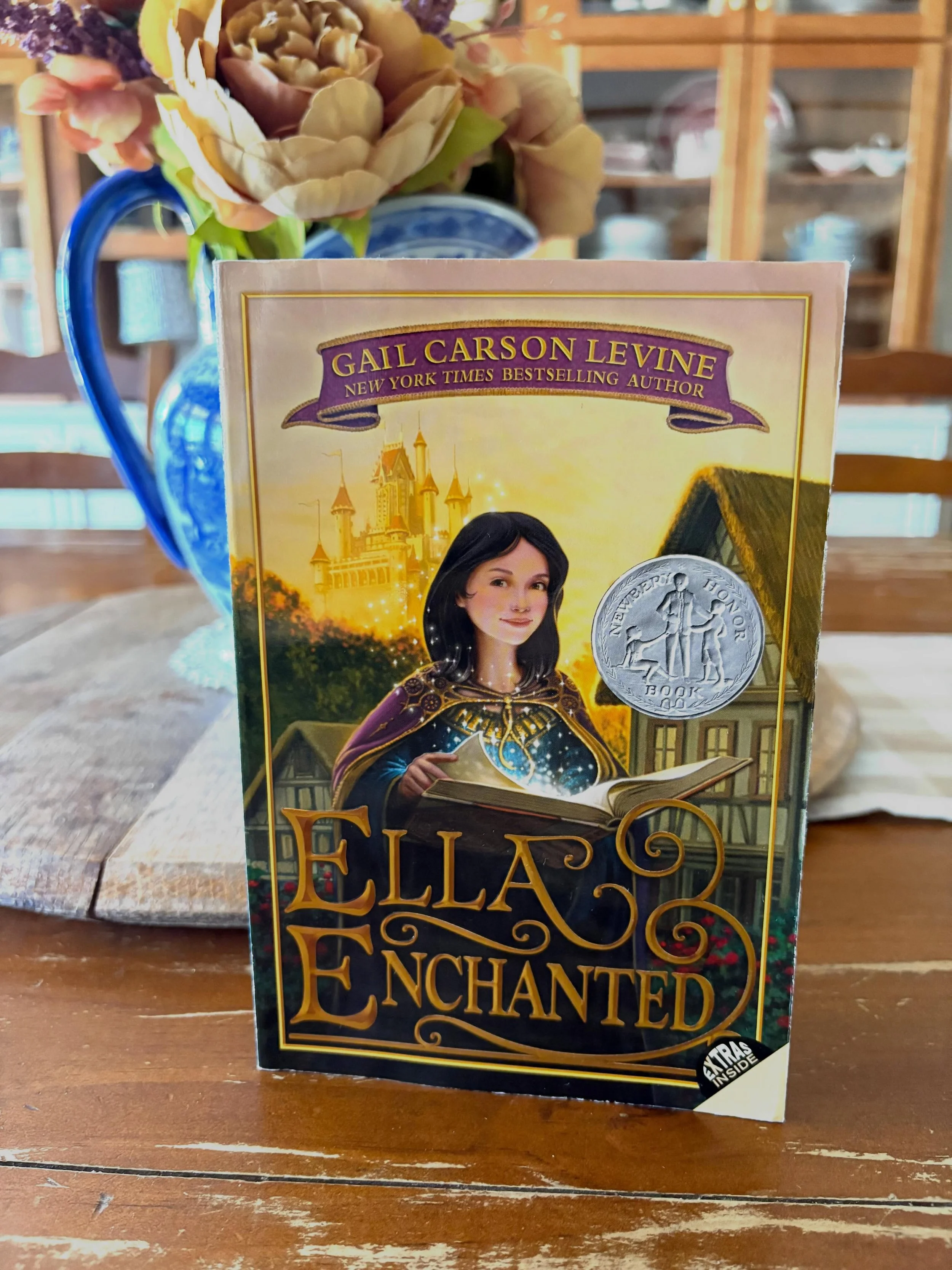 &ldquo;Ella Enchanted&rdquo; by Gail Carson Levine, 1997

&ldquo;This beloved Newbery Honor-winning story about a feisty heroine is sure to enchant readers new and old. 

At her birth, Ella of Frell receives a foolish fairy&rsquo;s gift&mdash;the &ld