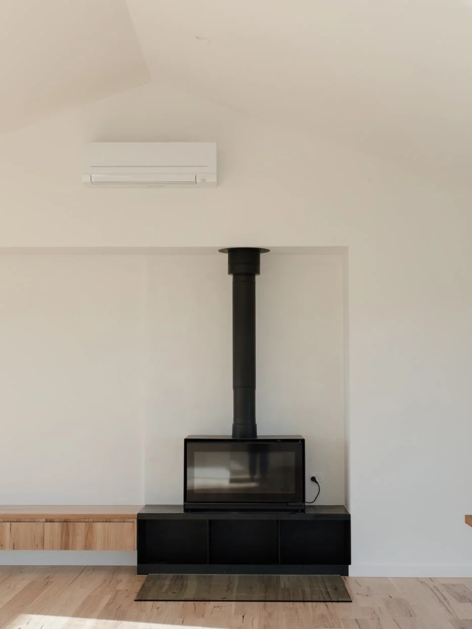 Stepping back into one of our most loved projects - Wreck Beach. 

As the cooler months roll in, we&rsquo;re taking a moment to appreciate the calm, light-filled interior of this home, where warmth, open space and the glow of the fireplace create a p