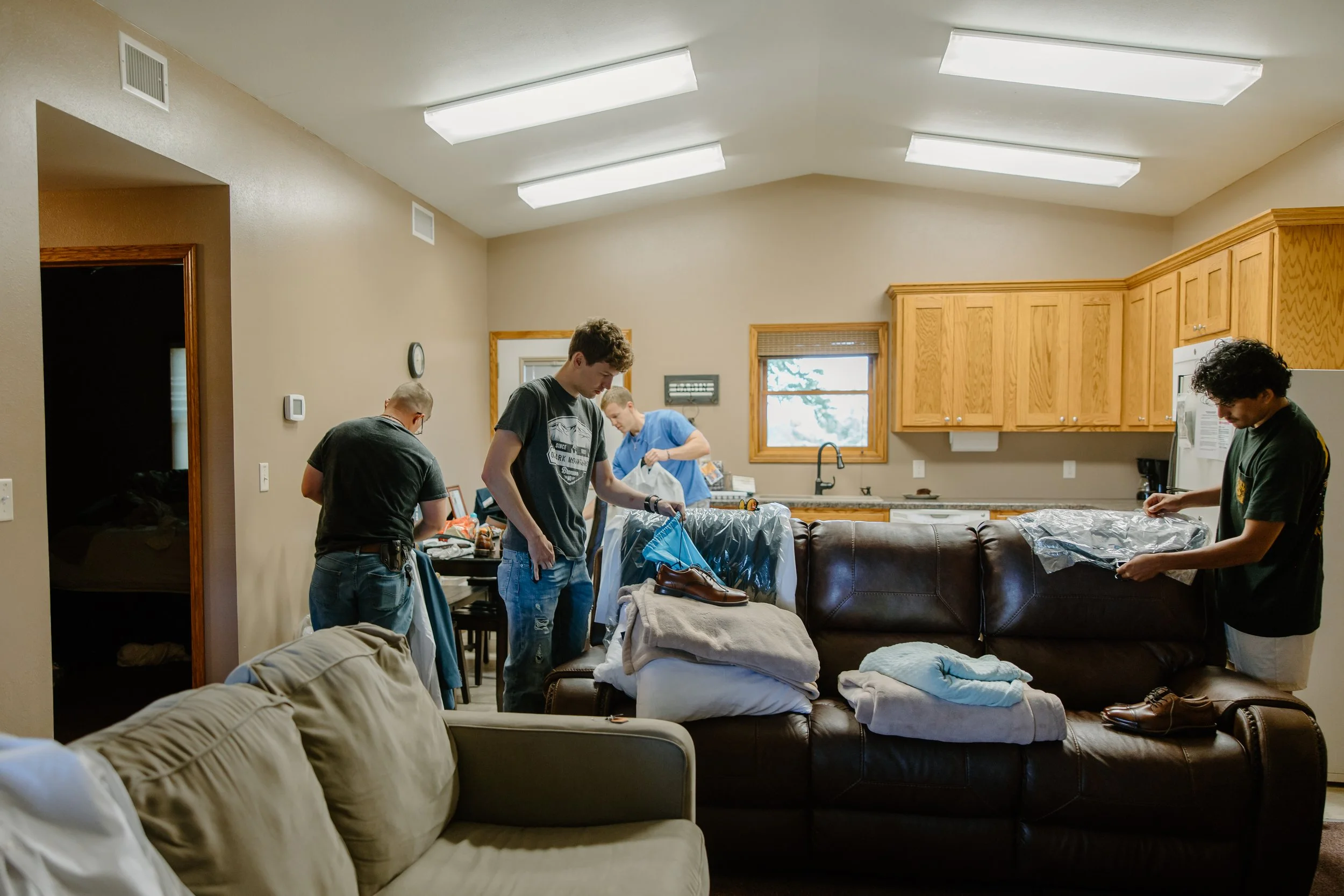 Groomsmen preparing for wedding in a Life's Finer Moments cabin.