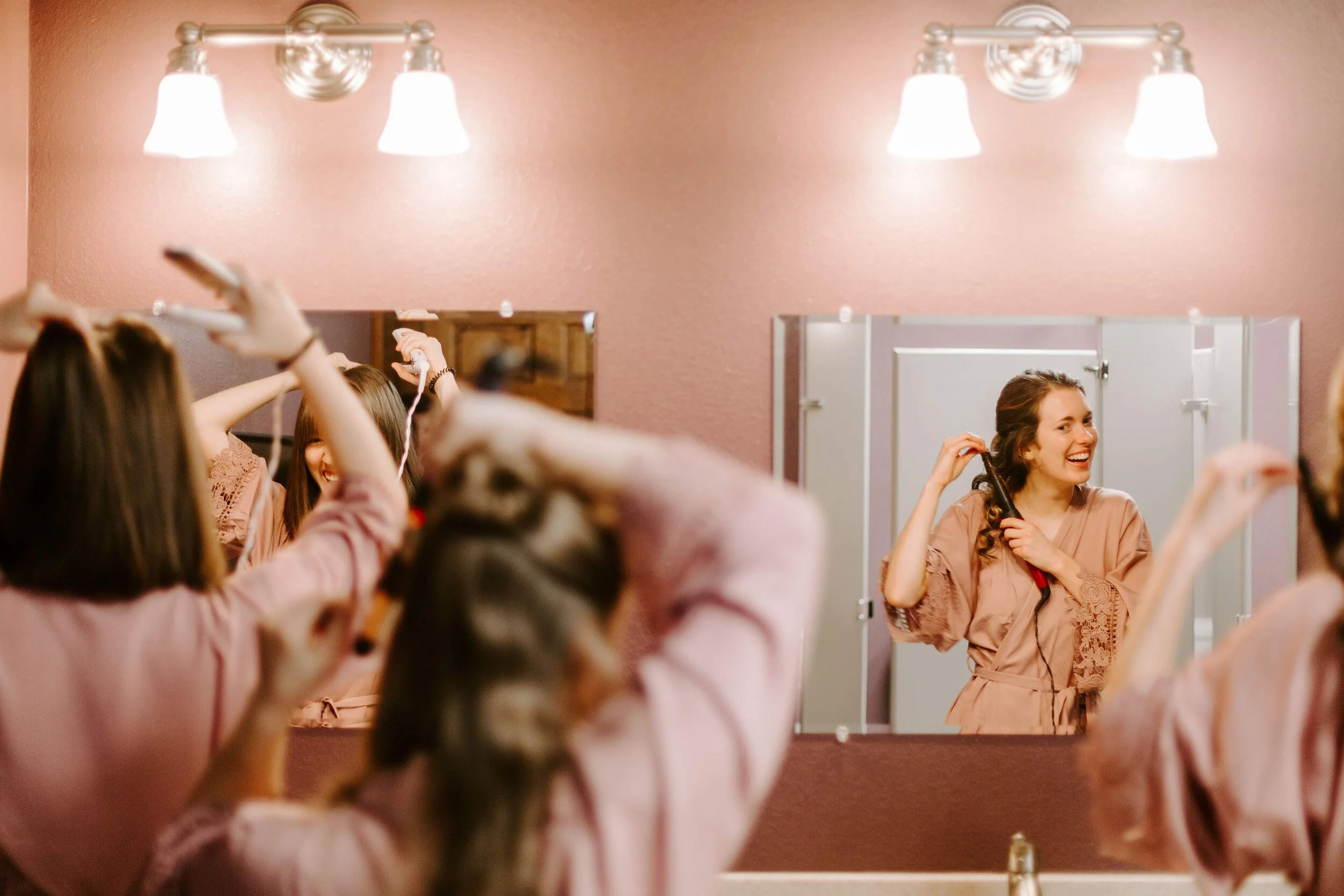 Bridesmaids prepping in bridal suite in a Kansas wedding venue.