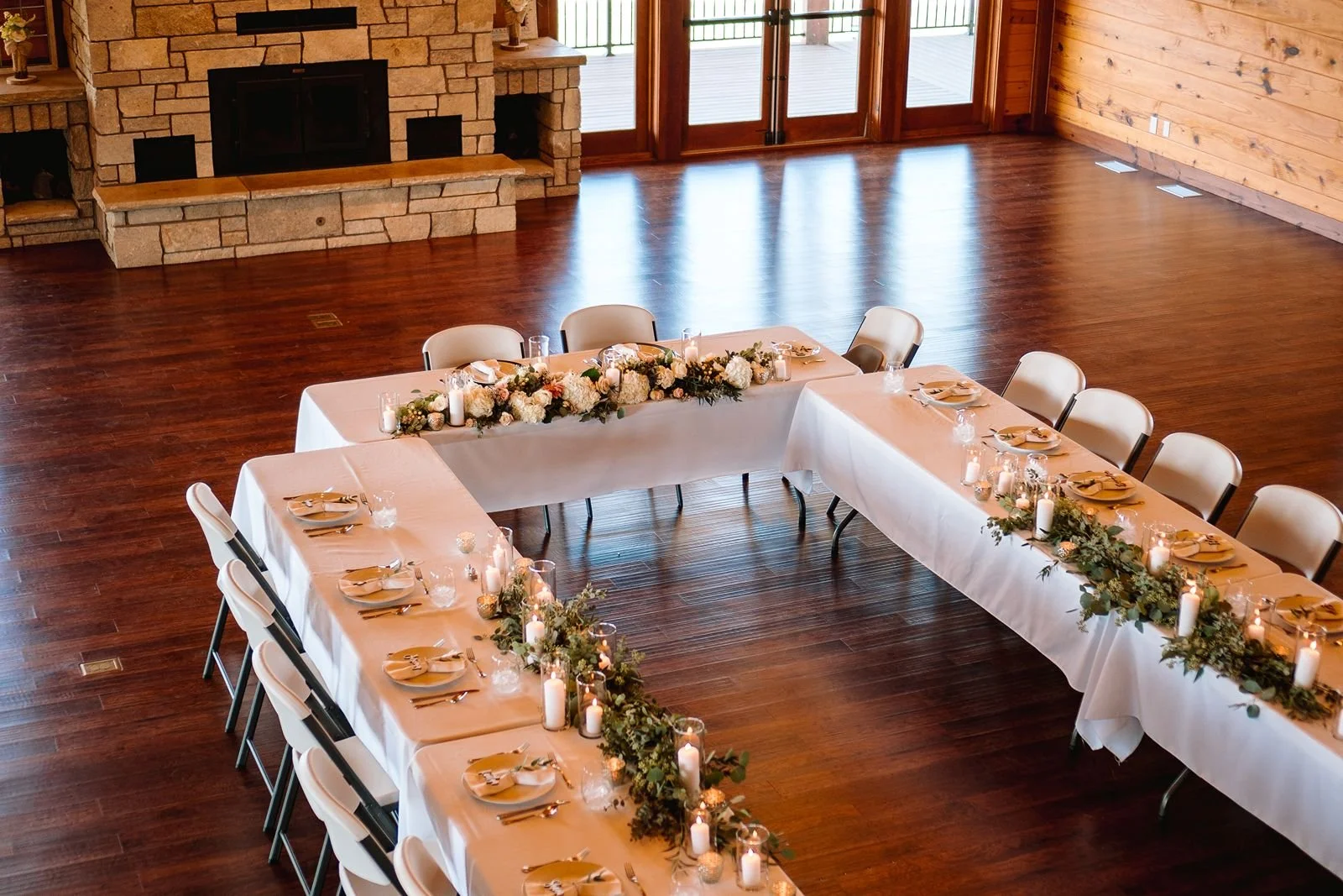 Life's Finer Moments Great Room with wedding tables decorated for small group.
