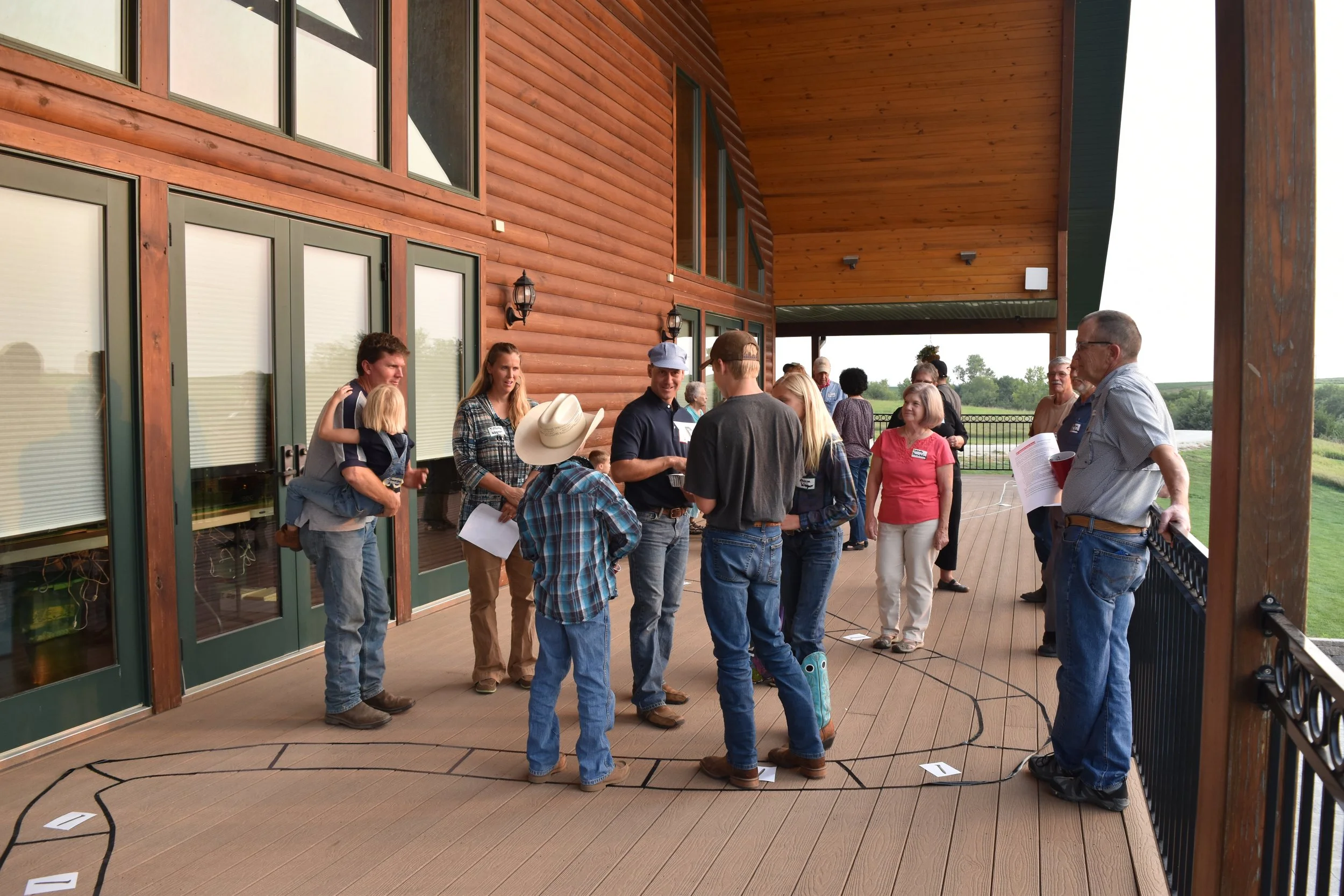 Guests playing train game on deck of Life's Finer Moments