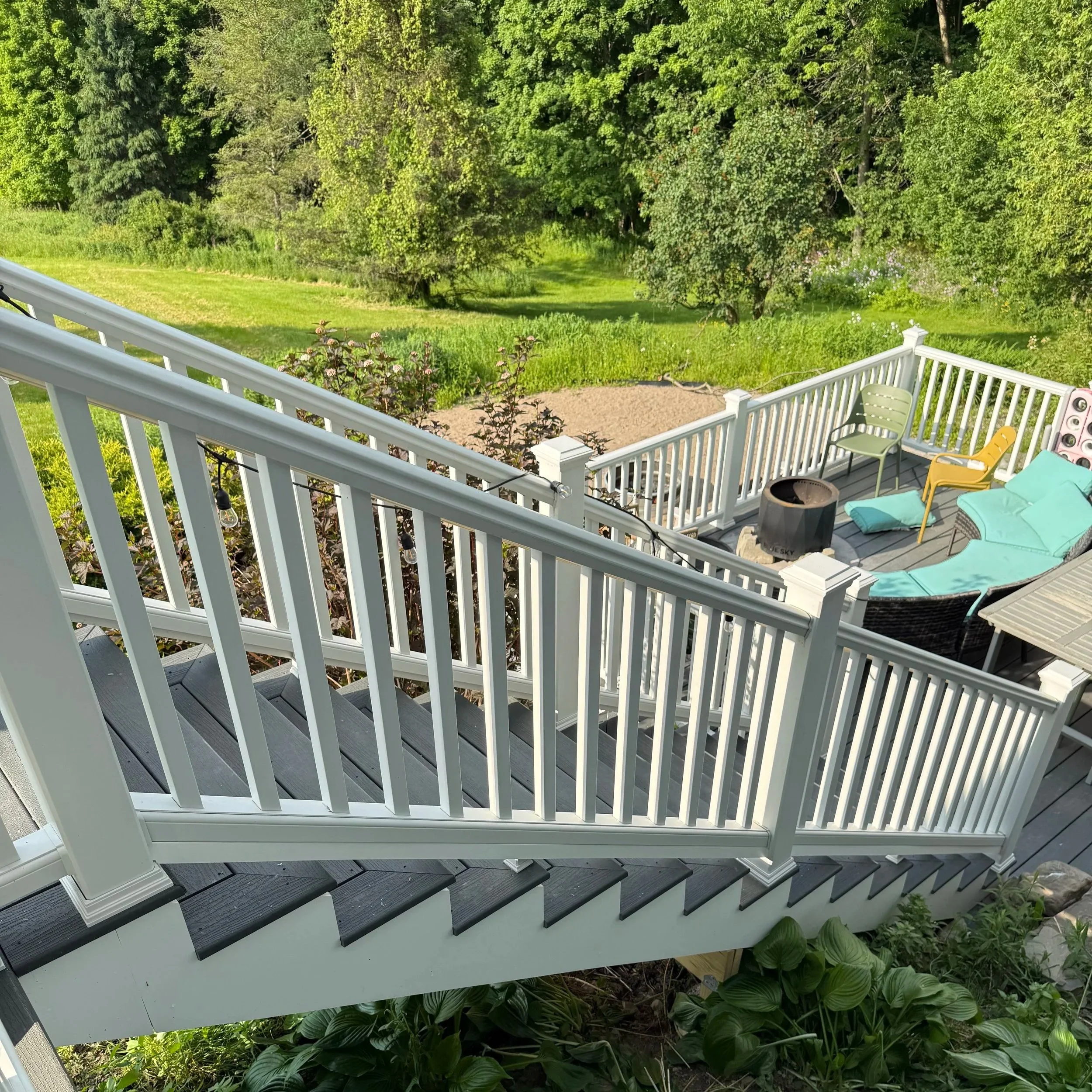 A set of composite stairs connects two newly constructed composite decks, constructed by C. Cooper Construction based in Hamilton, NY.
