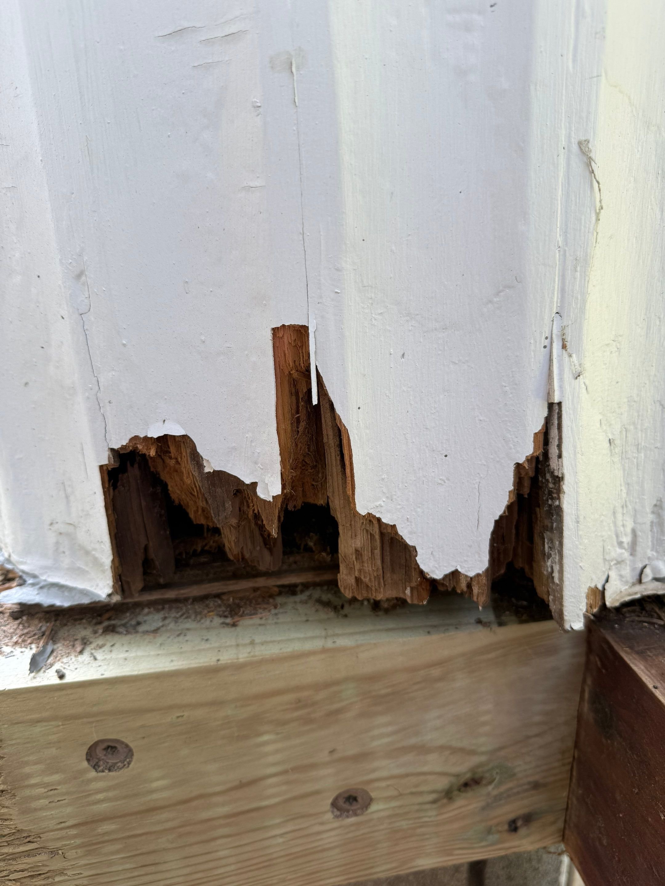 Rot at the base of a fluted column, or doric column, on a greek revival home