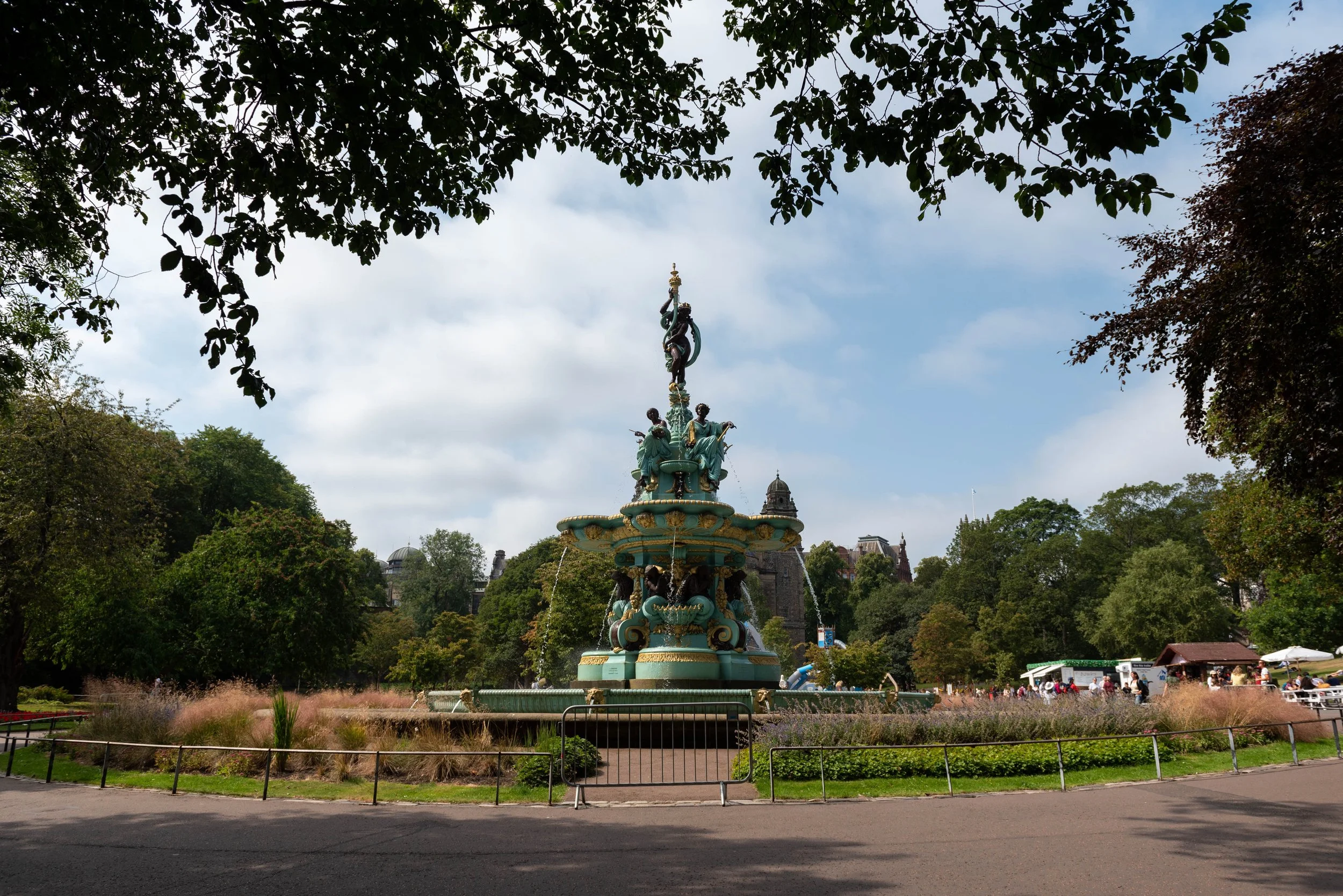 Ross Fountain in Princes Street Gardens, with tree leaves framing the top of the photo