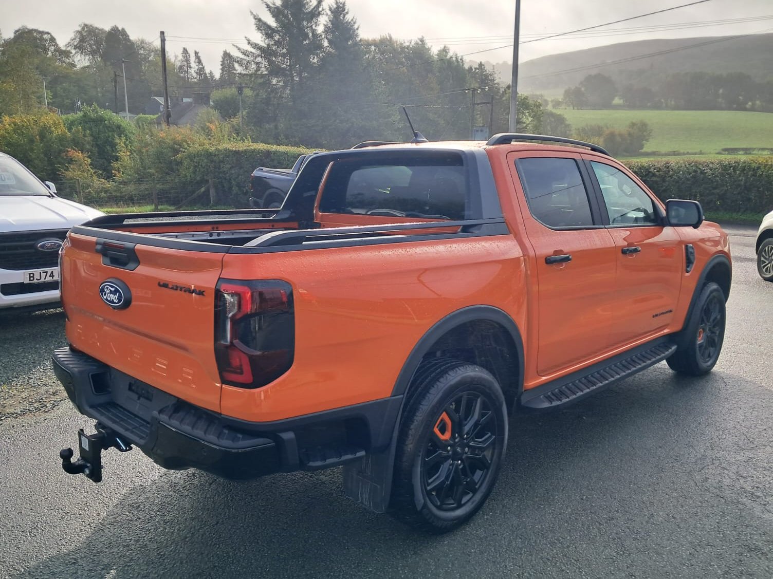 Orange 76 Ford Ranger Wildtrak V6 Auto rear driver