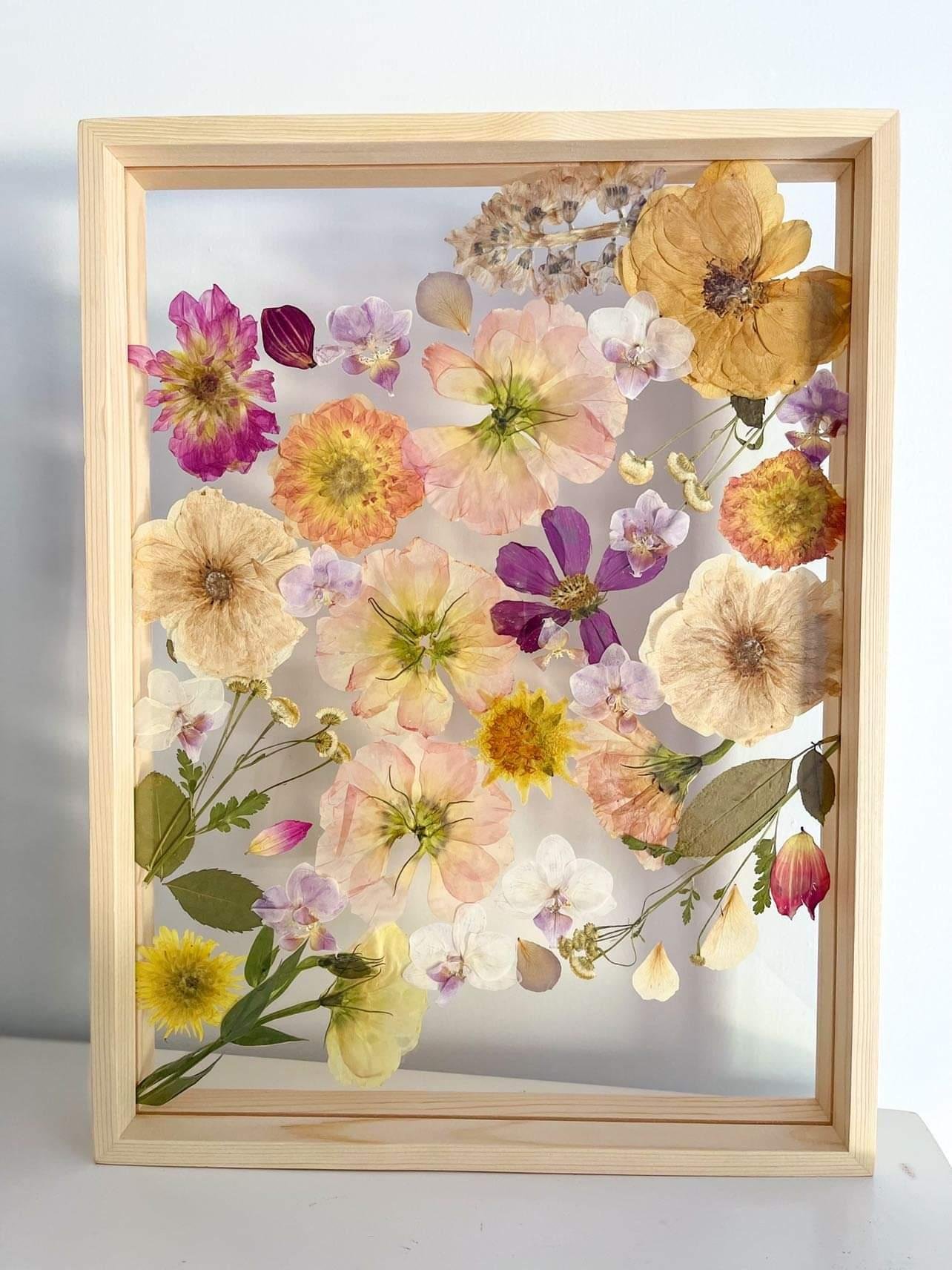 Framed pressed flower in resin hanging frame