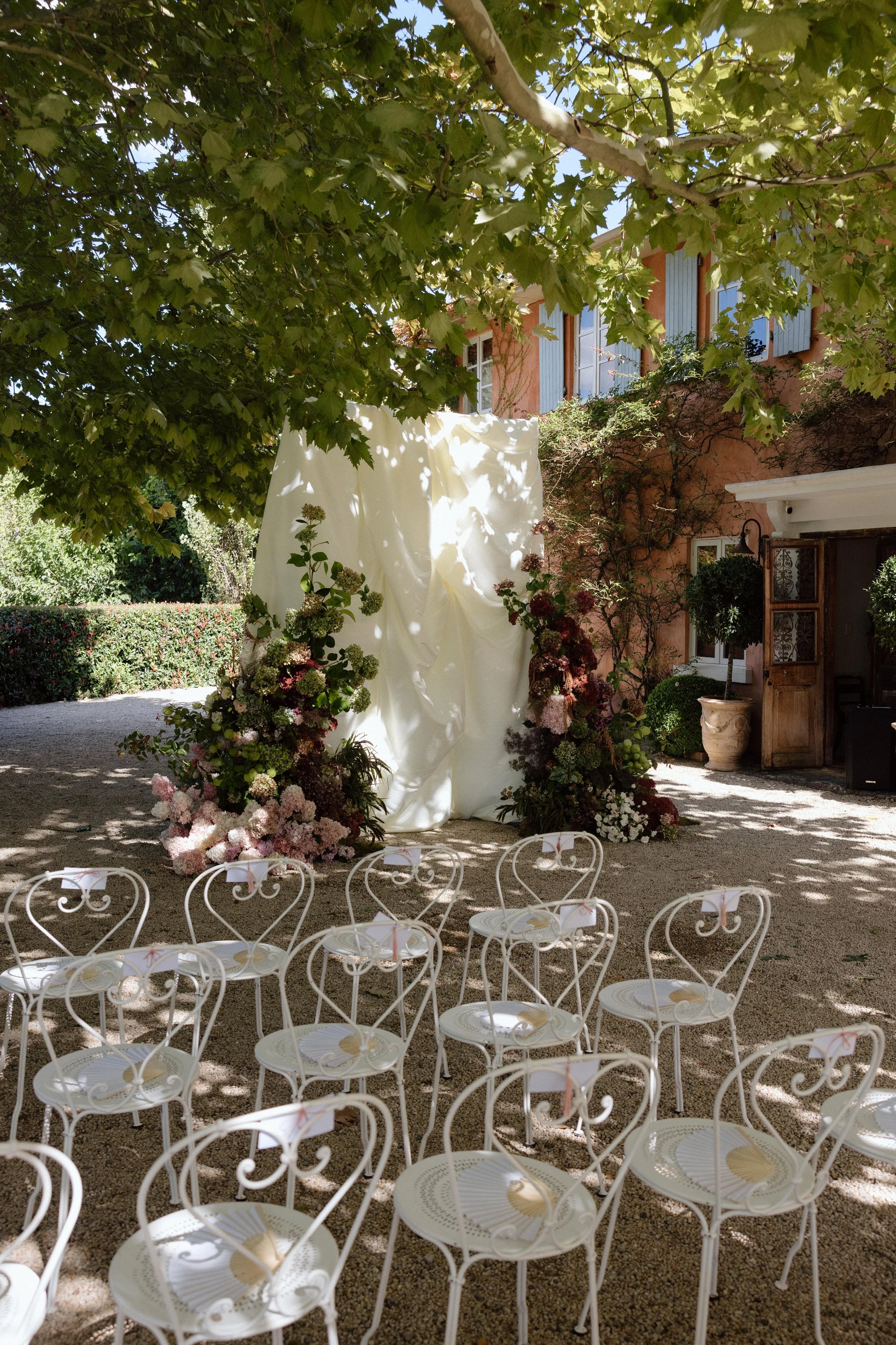 Bridal gown hanging outside Redleaf Wollombi, Hunter Valley wedding florals by The Naked Florist