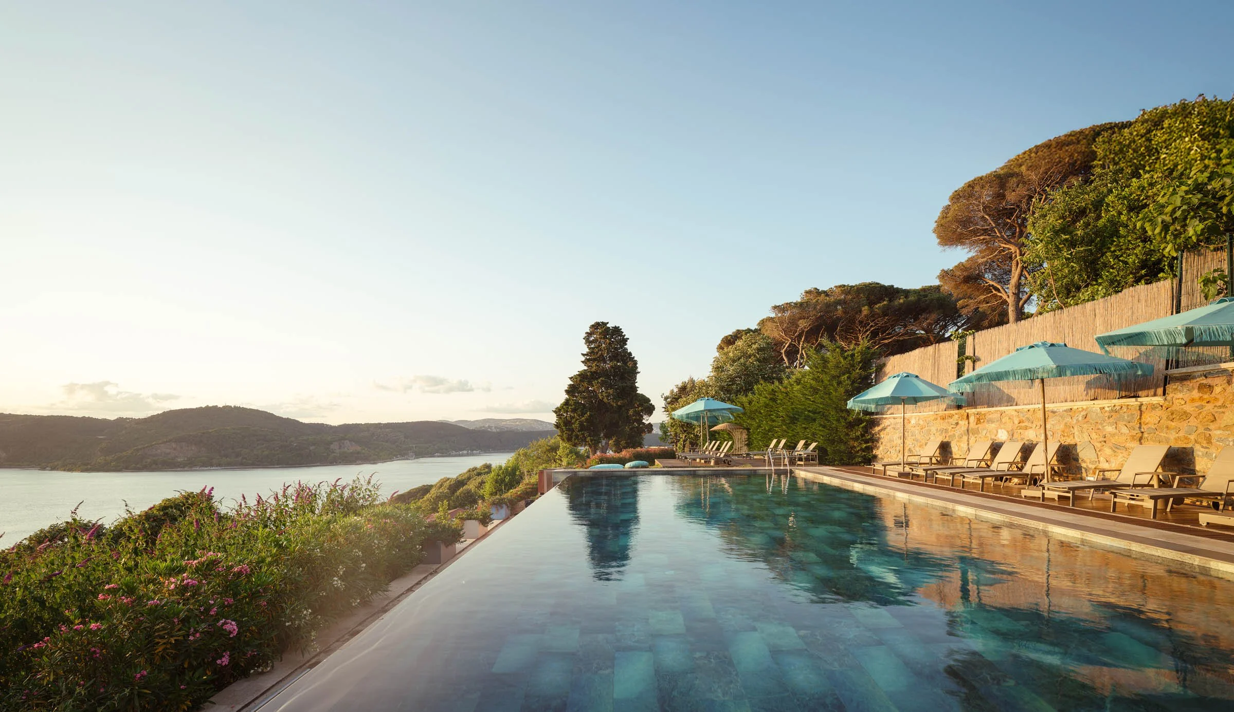 Six Senses Kocatas Mention Pool during sunrise