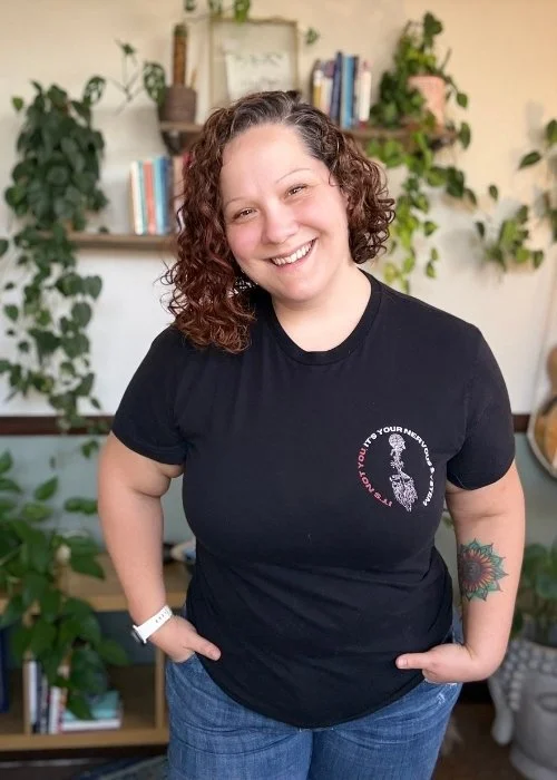 Kandace Ledergerber wearing an "It's Not You, It's Your Nervous System" shirt