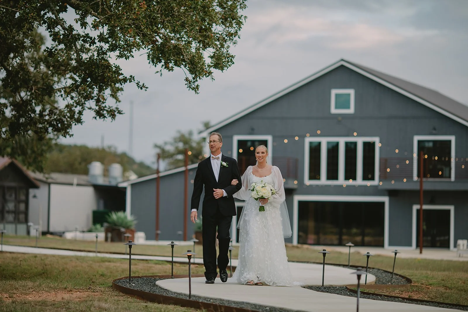 bride-walking-down-the-aisle-hill-country-wedding.jpg