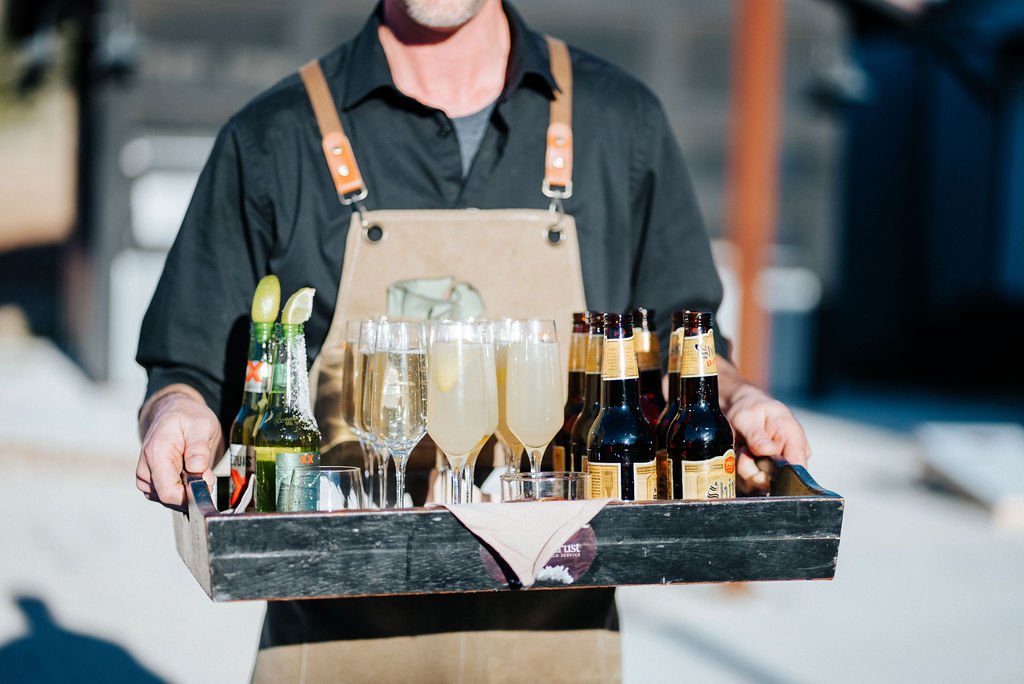 Serving drinks for outdoor cocktail hour at event venue in Fredericksburg, Texas.
