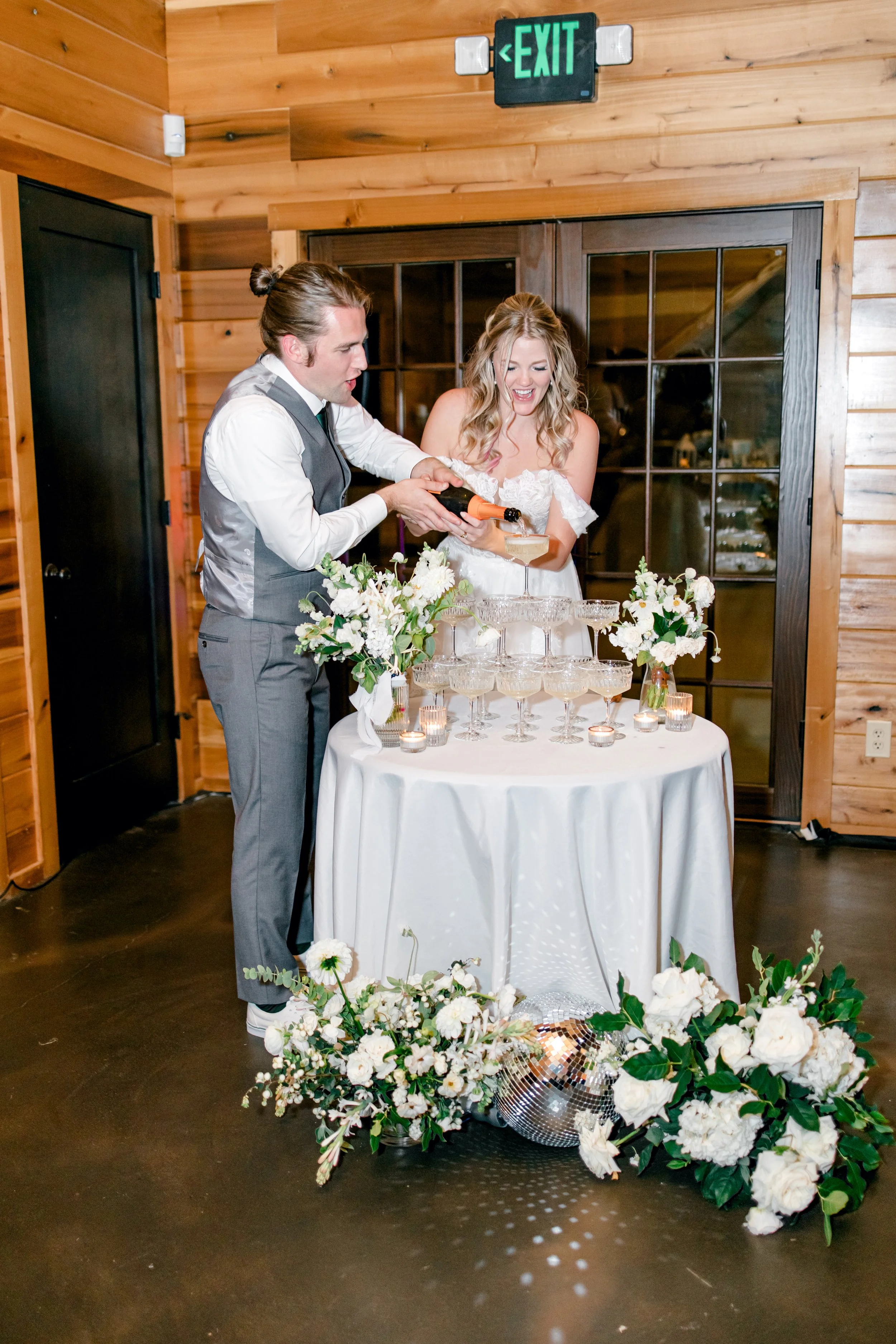 white-florals-champagne-tower-at-texas-wedding-venue.jpg.jpg