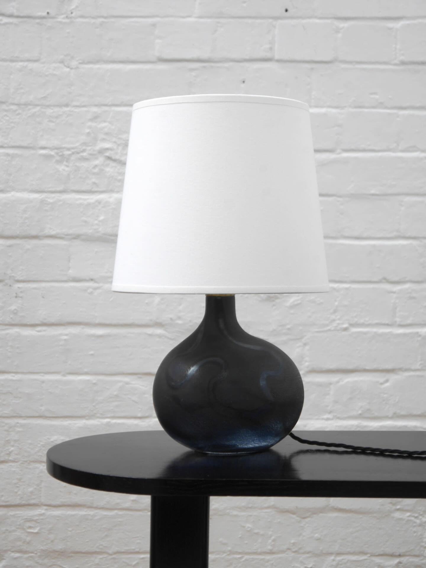 Beautifully shaped &lsquo;Asymmetrisk&rsquo; lamp by Michael Bang for Holmegaard, Denmark, 1970s. Hand-blown glass in an asymmetrical sculptural form, matte finish with contrasting wavy decoration. 

New off-white cotton shade. PAT tested and ready t