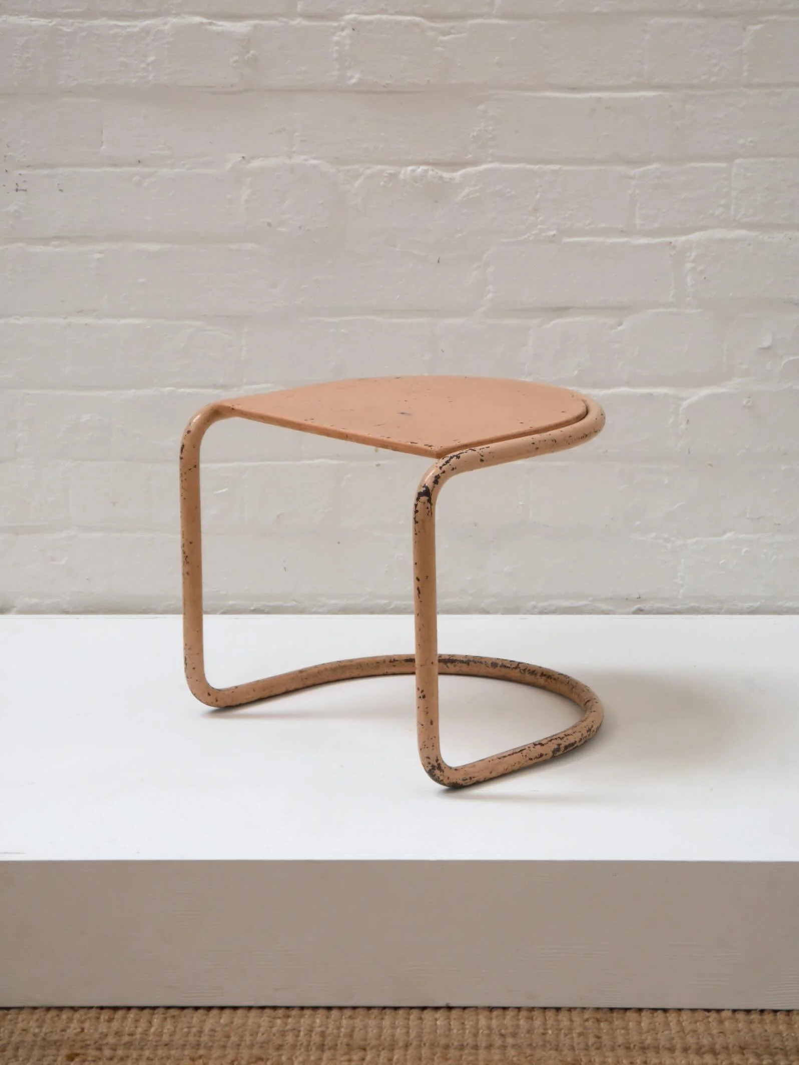 One of my favourite pieces from this week&rsquo;s stock update is this small modernist tubular steel stool. 1930s, most probably English and possibly by Pel. What drew me to it most is the old overpainted pink/peach colour, now heavily worn. It remin