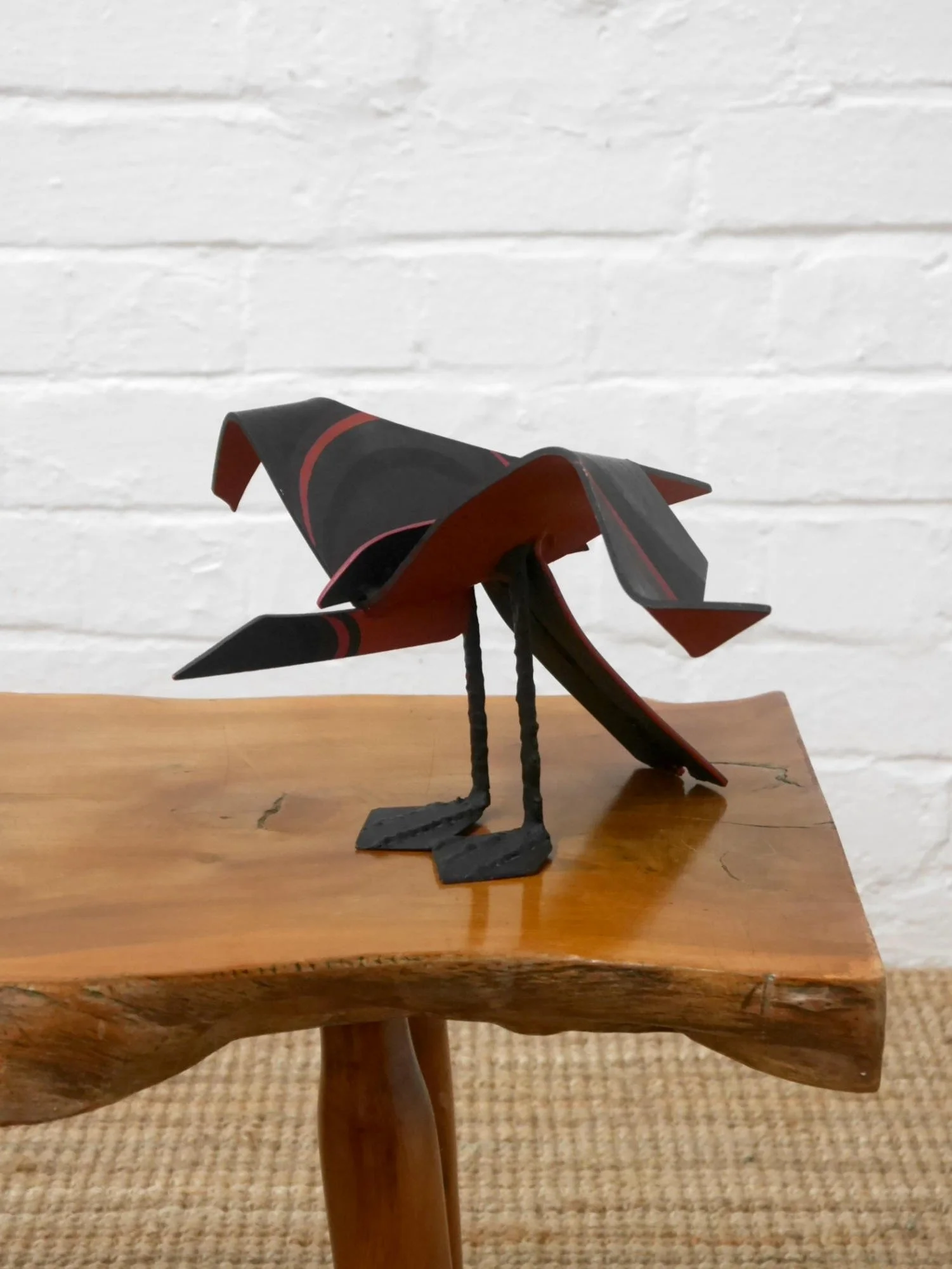 Metal bird sculpture by Lucy Wynne