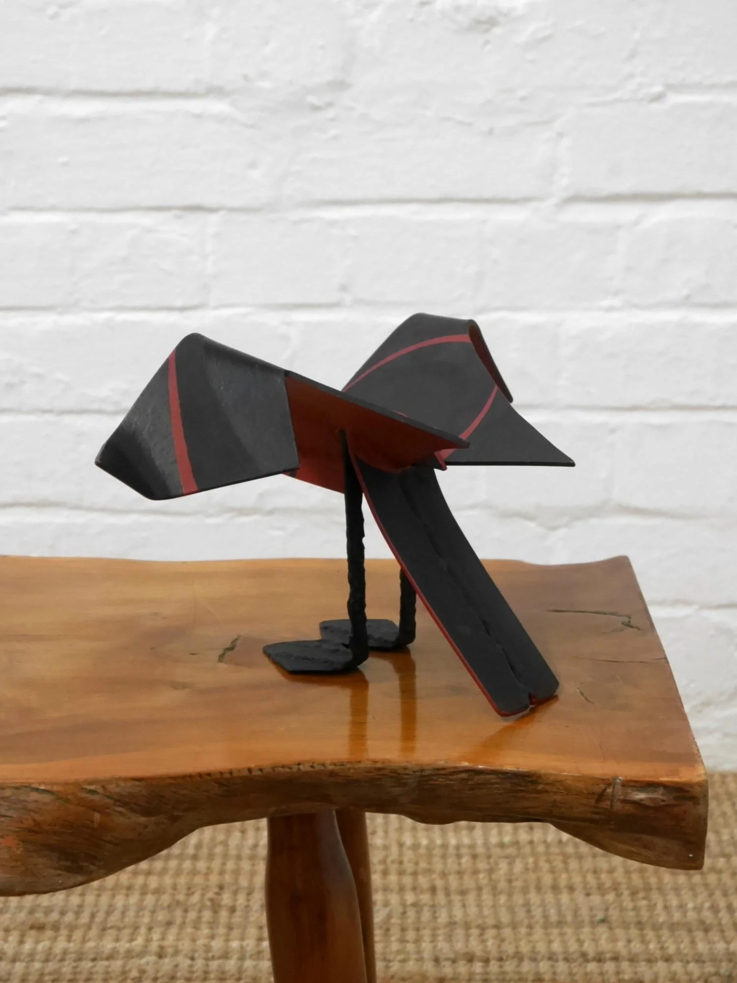 Metal bird sculpture by Lucy Wynne