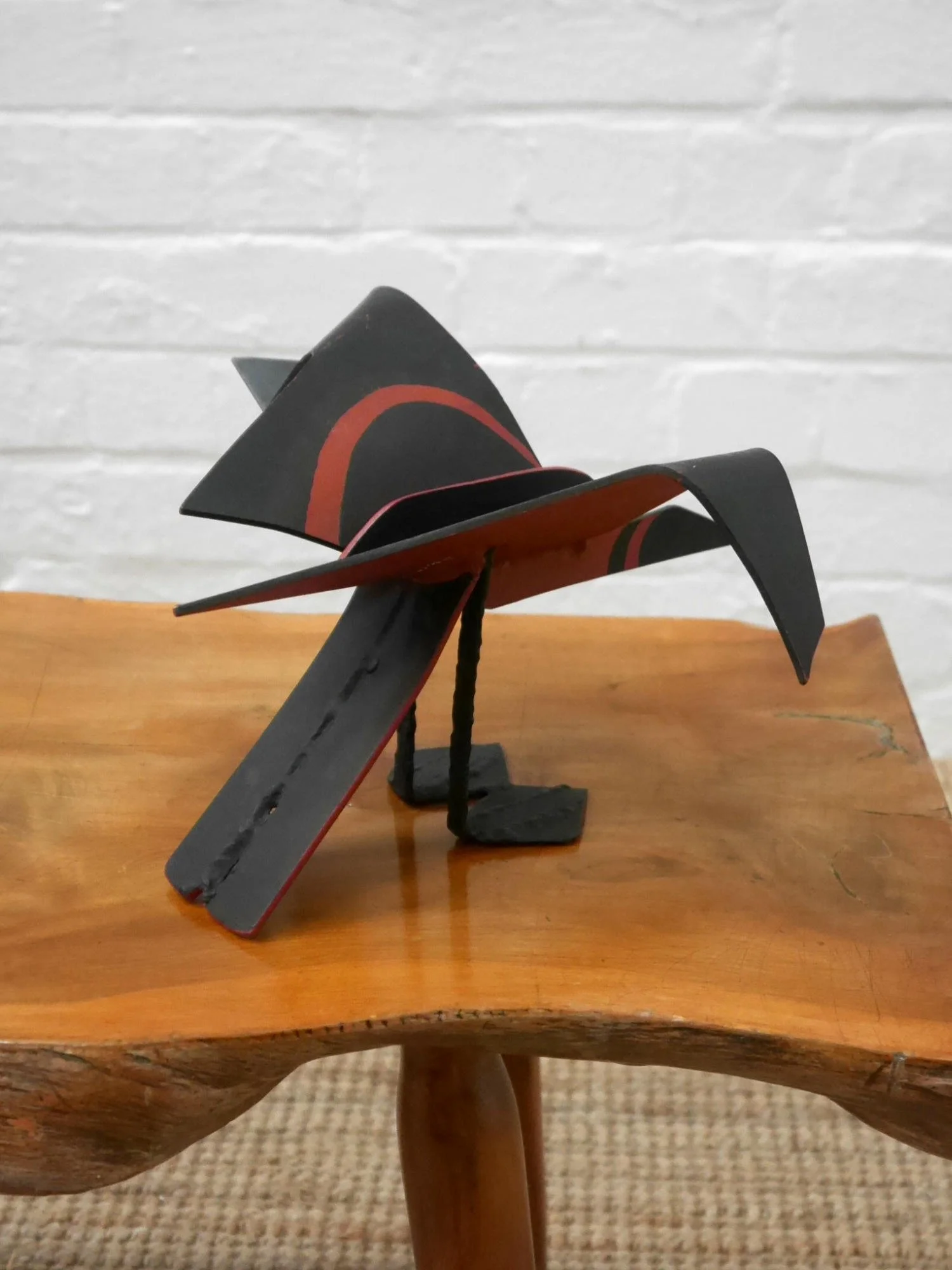 Metal bird sculpture by Lucy Wynne