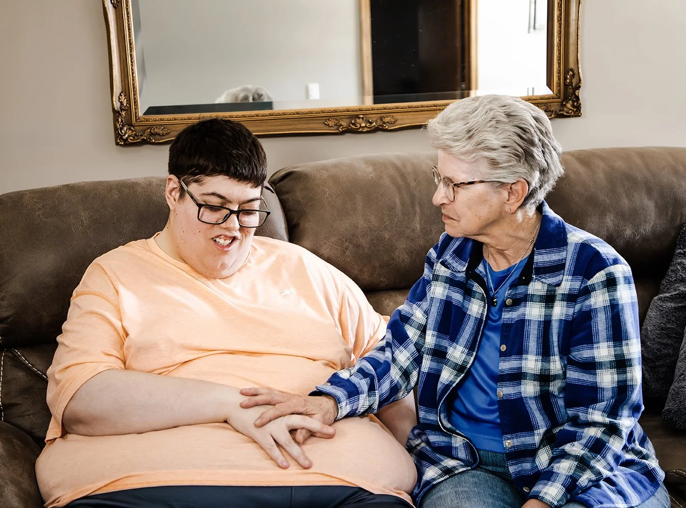Caregiver with adult male living with developmental disabilities