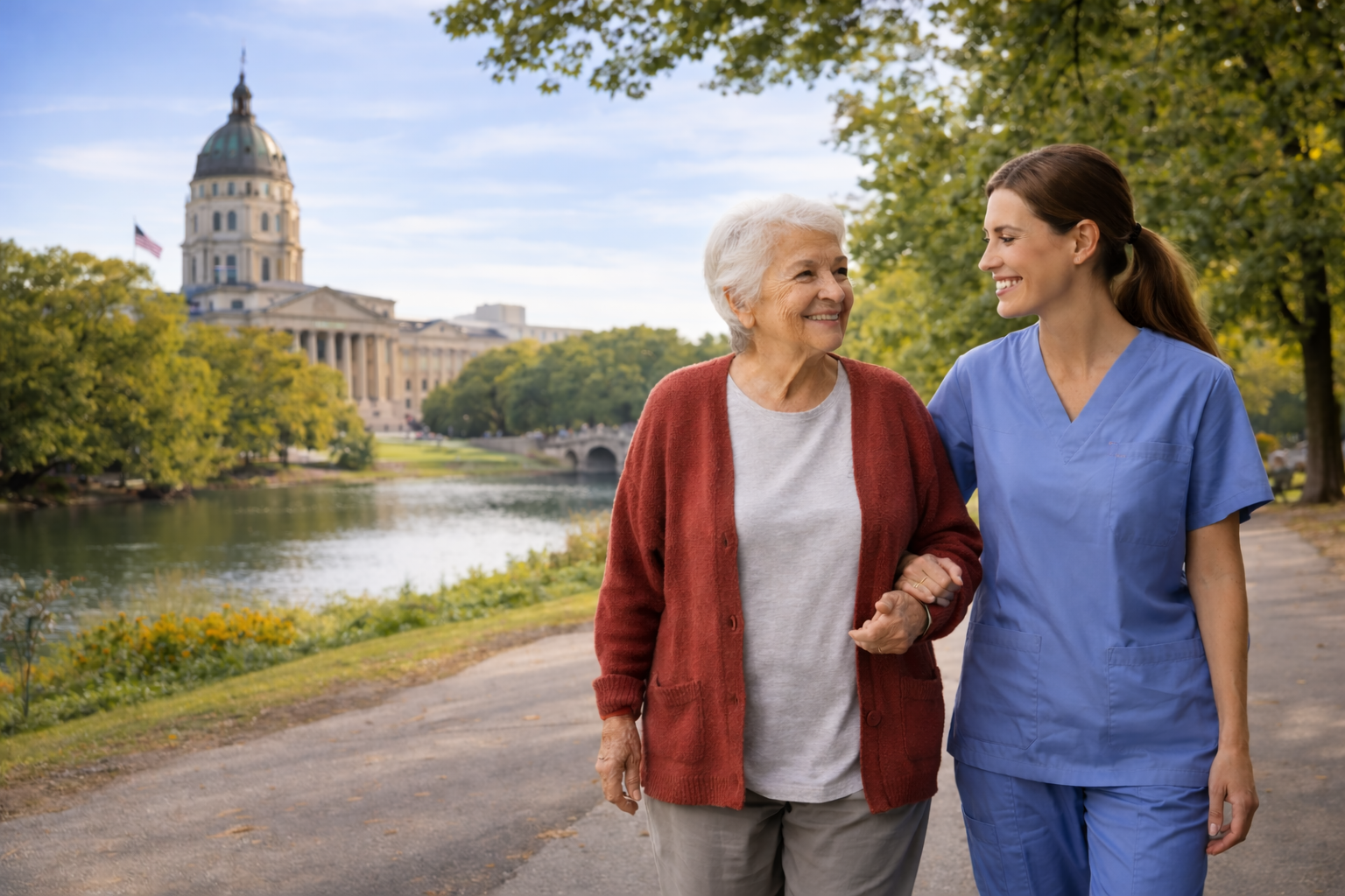 Caretech caregiver and senior walking along a park path in Topeka, Kansas