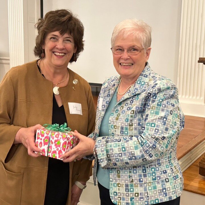 Judy Owens accepts a beautiful engraved julep cut from outgoing treasurer Gayle Hutcherson.