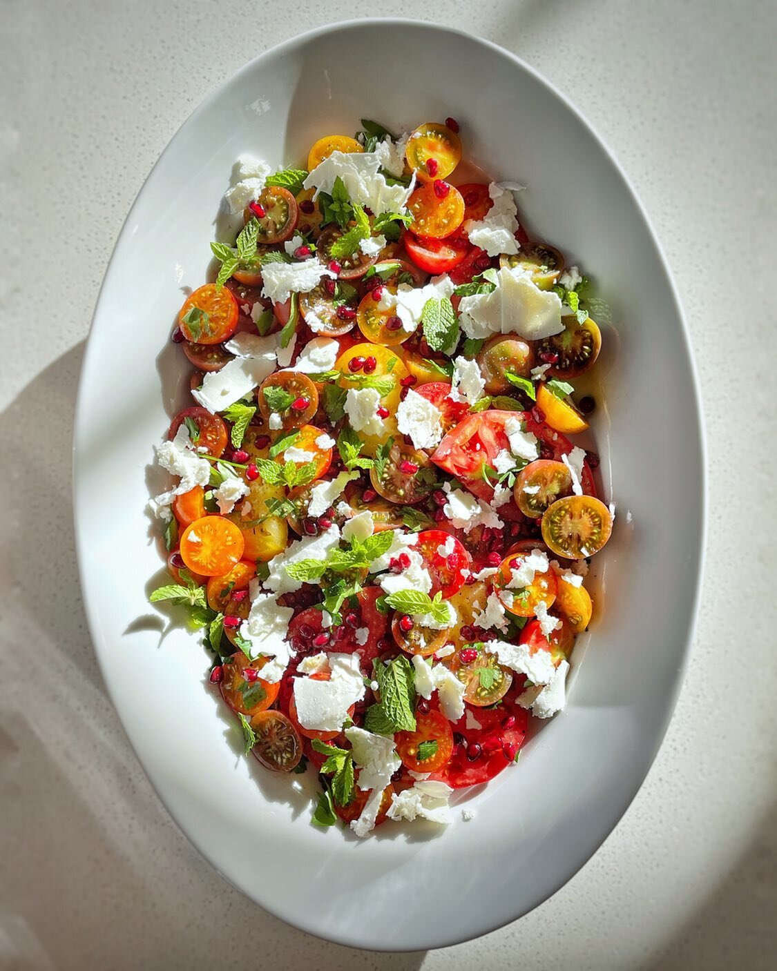 Heirloom cherry tomato and pomegranate salad with shaved manoiri cheese, fresh mint from the garden and a Meyer lemon vinaigrette 
&bull;
&bull;
&bull;
&bull;
&bull;
#foodiesofinstagram #privatechef #food4thought #farmfresh #farmtotable #foodies #foo