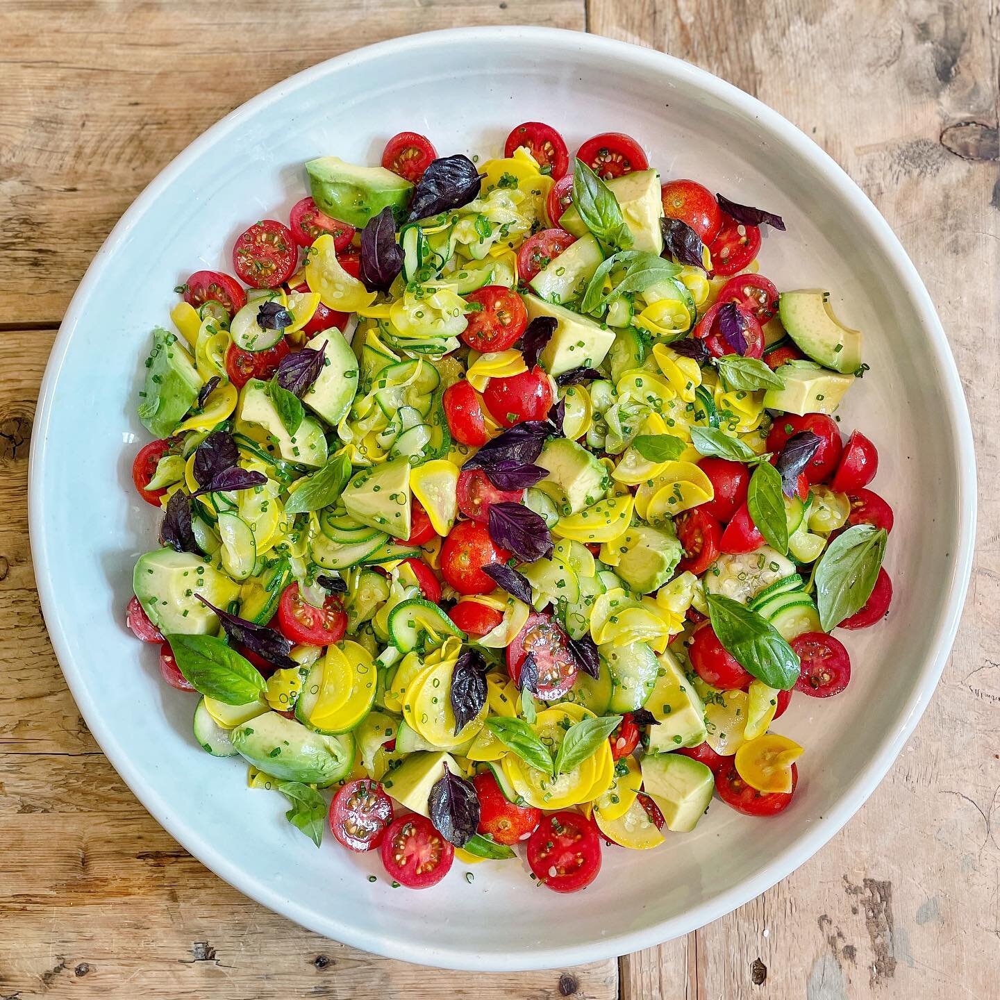 Doesn&rsquo;t get any fresher than this chilled summer squash, tomato and avocado salad with meyer lemon and all the beautiful basils from the garden! 

Such a simple recipe. Just thinly slice summer squash with a knife, mandoline or food processor. 