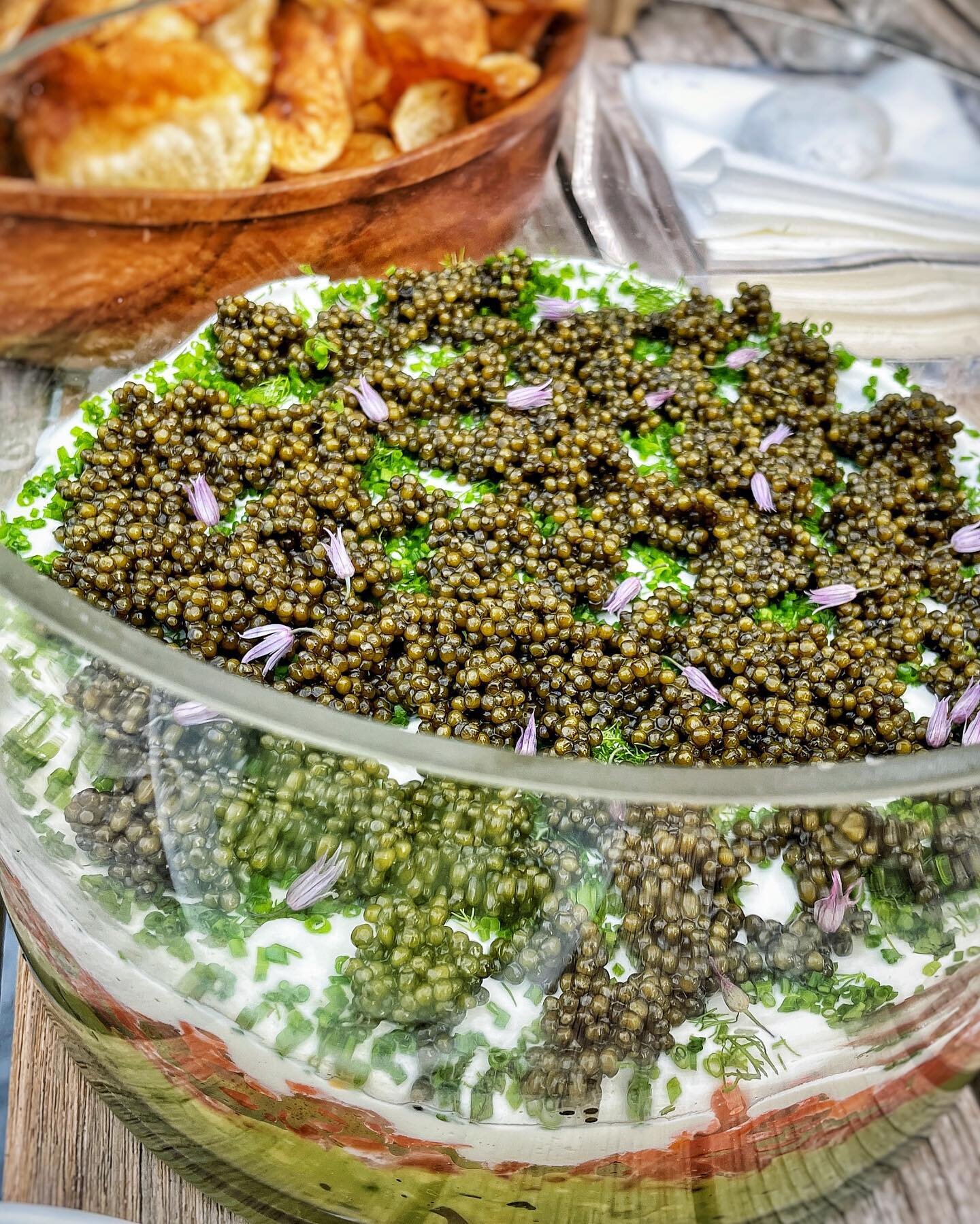 Five layer caviar dip is the ultimate Hamptons canap&eacute;! Start with a layer of smash avocado, then smoked salmon tartar, next a lemon crem&eacute;, fresh spring herbs from the garden and last but definitely not least, lots of golden ossetra cavi