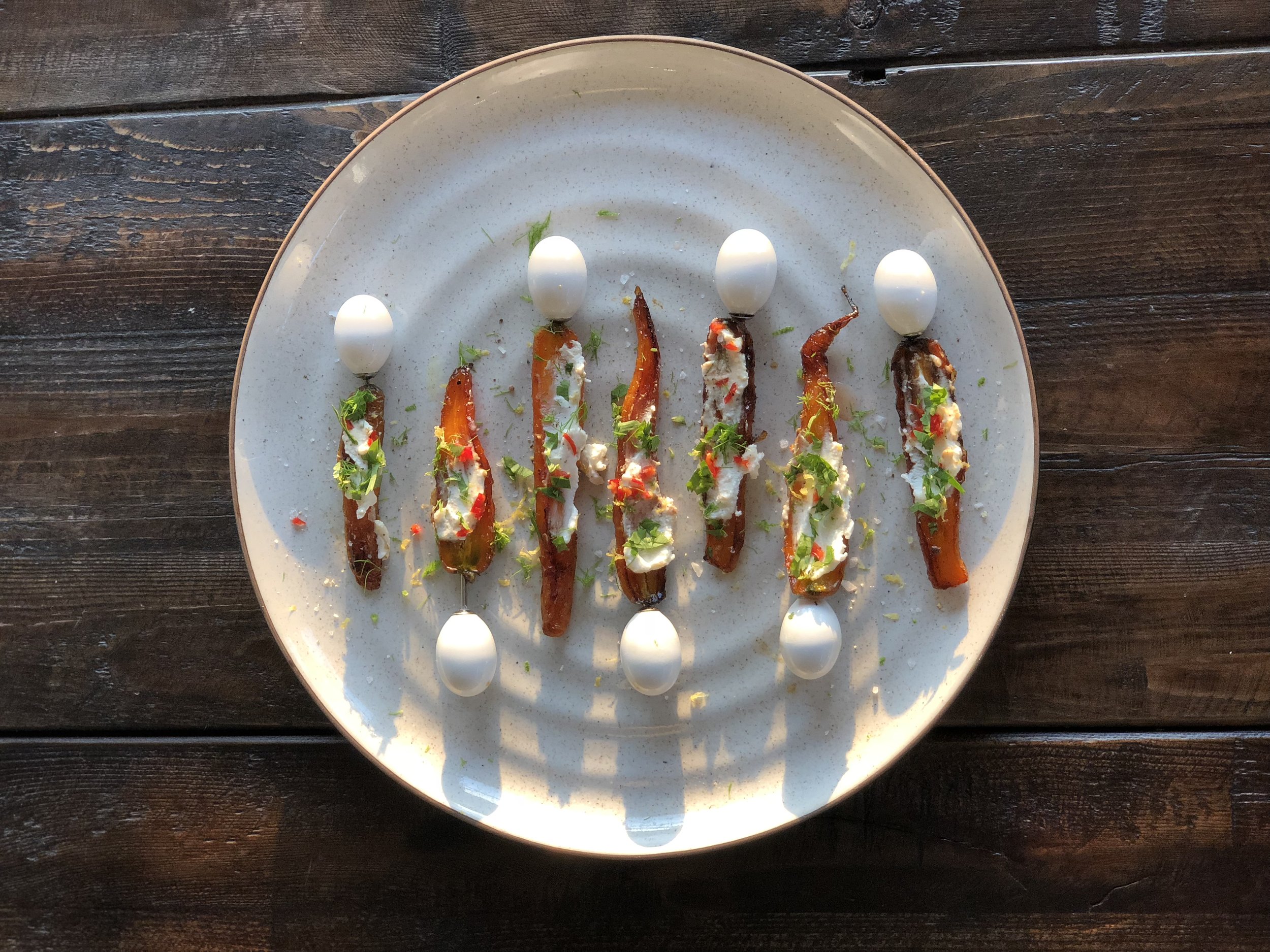 Honey and chipotle roasted carrot skewers with goatcheese, lime zest and pickled chilies