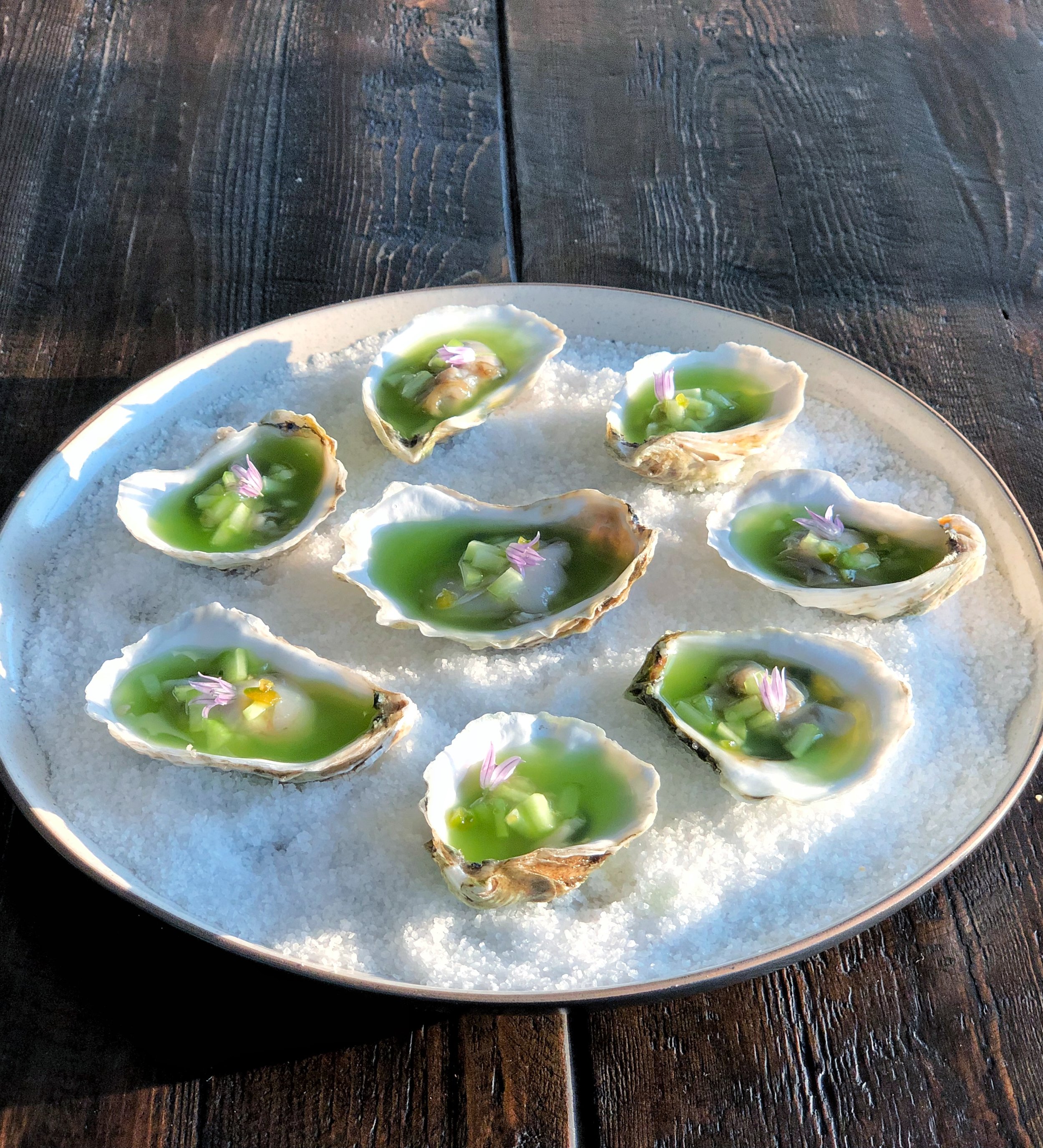 Oysters on the halfshell with a jalapeno, cucumber and tequila aquachile