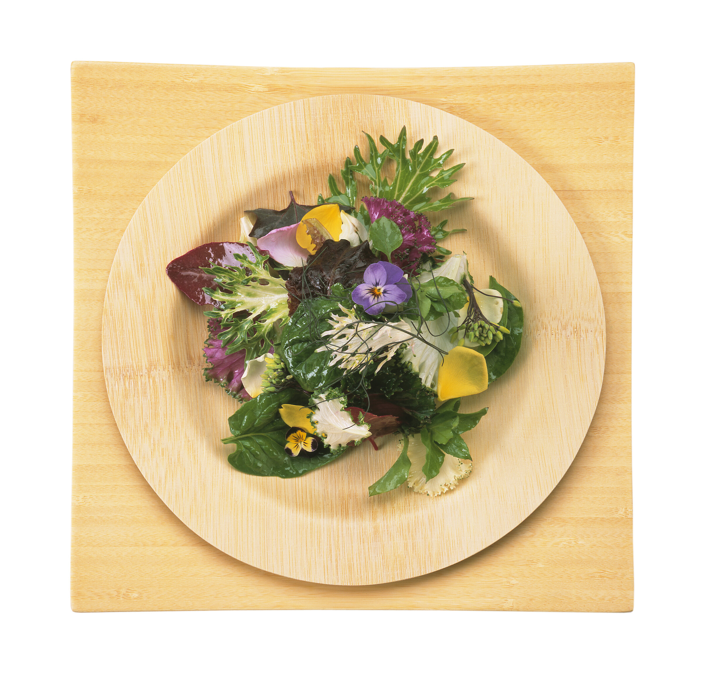 alad with edible flowers on bamboo plate.jpg