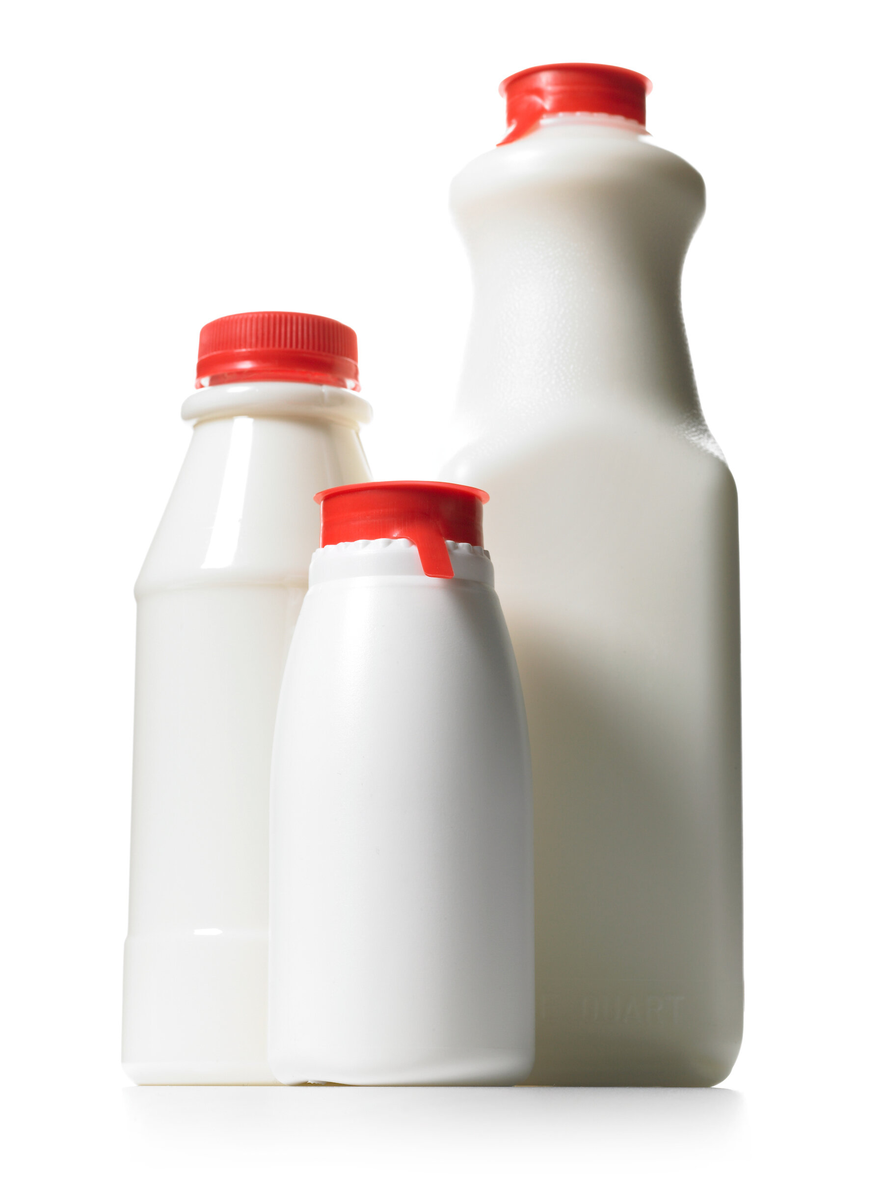 Milk in plastic bottles with red caps.jpg