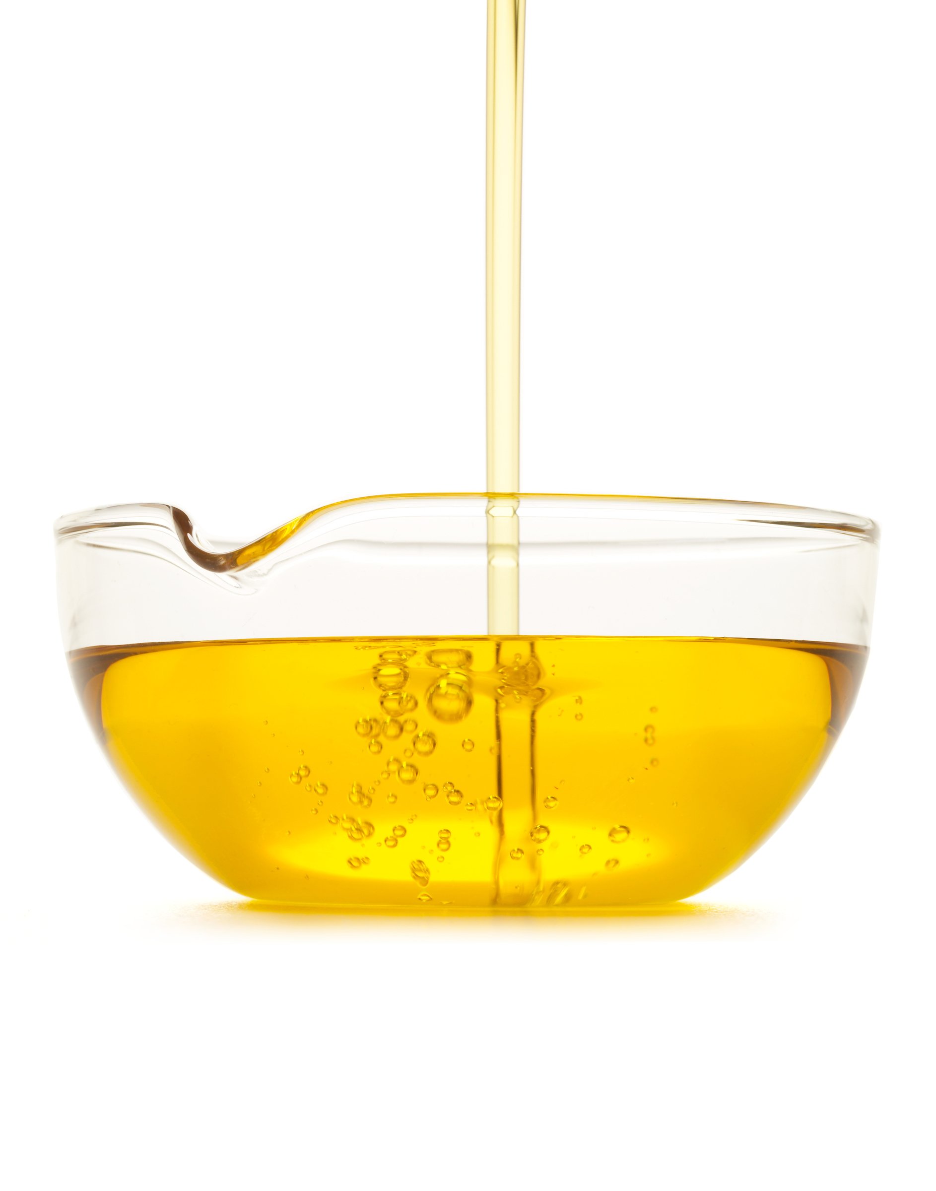 Oil pouring into glass bowl.jpg
