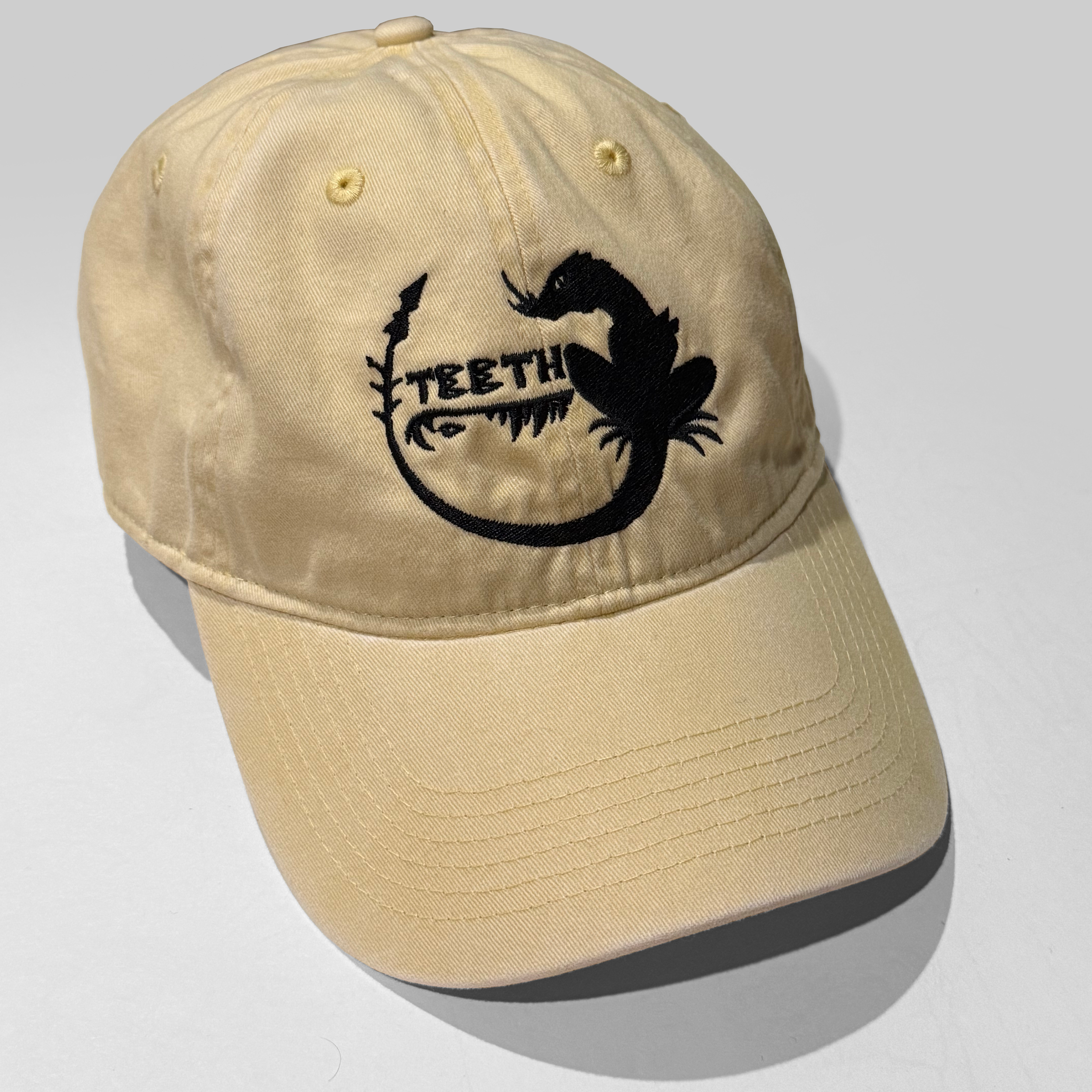 Teeth Lizard Logo Butter.png